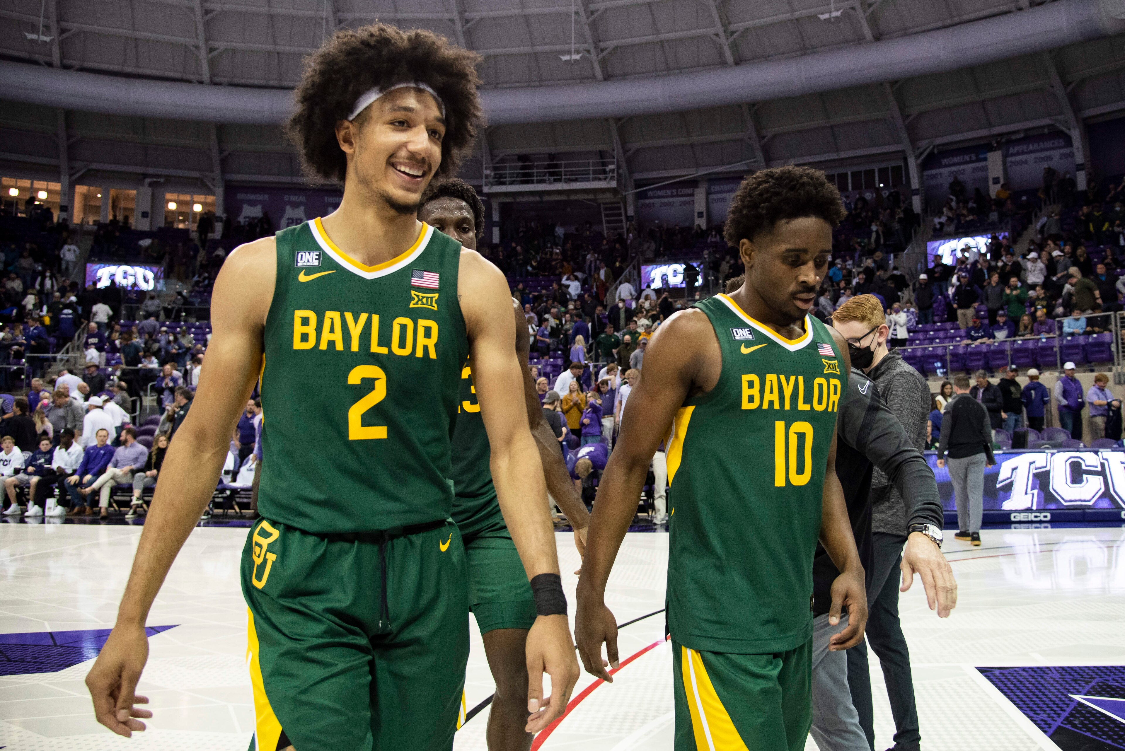 Baylor guard Kendall Brown (2) smiles as he, forward Jonathan Tchamwa Tchatchoua, center back, and guard Adam Flagler (10) walk off the floor after an NCAA college basketball game against TCU in Fort Worth, Texas, Saturday, Jan. 8, 2022. (AP Photo/Emil Lippe) Baylor guard Kendall Brown (2) smiles as he, forward Jonathan Tchamwa Tchatchoua, center back, and guard Adam Flagler (10) walk off the floor after an NCAA college basketball game against TCU in Fort Worth, Texas, Saturday, Jan. 8, 2022. (AP Photo/Emil Lippe)