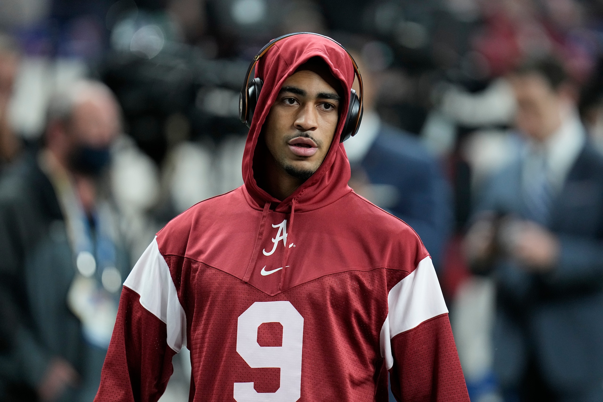 Alabama's Bryce Young warms up the College Football Playoff championship football game against Georgia Monday, Jan. 10, 2022, in Indianapolis. (AP Photo/Paul Sancya)