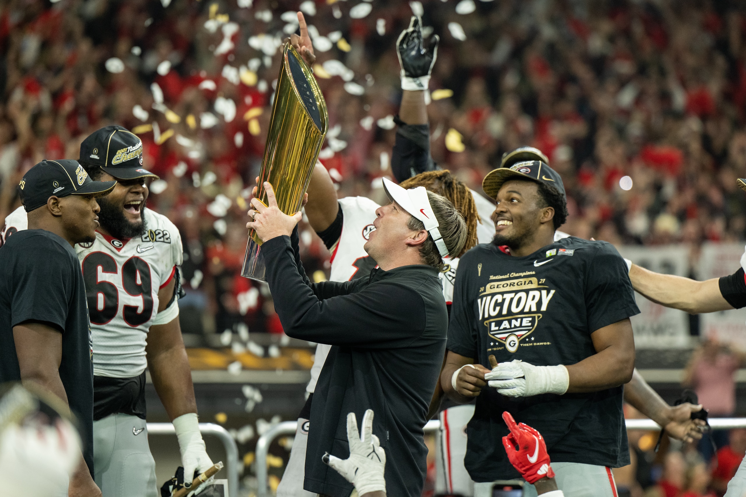 INDIANAPOLIS, IN - JANUARY 10: Georgia Bulldogs head coach Kirby Smart holds the national championship trophy after the Alabama Crimson Tide versus the Georgia Bulldogs in the College Football Playoff National Championship, on January 10, 2022, at Lucas Oil Stadium in Indianapolis, IN. (Photo by Zach Bolinger/Icon Sportswire via Getty Images)