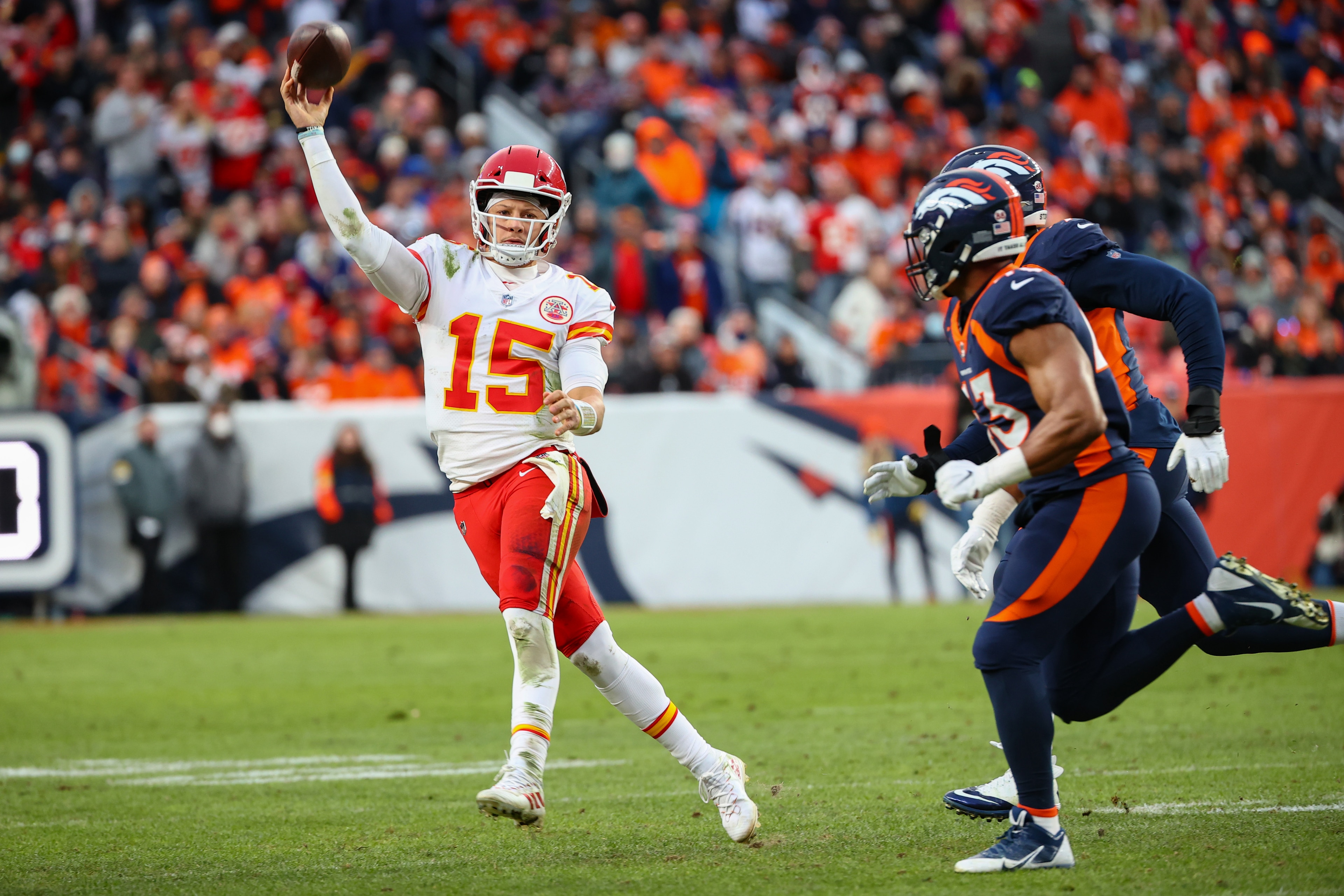DENVER, COLORADO - JANUARY 08: Patrick Mahomes #15 of the Kansas City Chiefs looks to pass during the second half against the Denver Broncos at Empower Field At Mile High on January 08, 2022 in Denver, Colorado. (Photo by Jamie Schwaberow/Getty Images) DENVER, COLORADO - JANUARY 08: Patrick Mahomes #15 of the Kansas City Chiefs looks to pass during the second half against the Denver Broncos at Empower Field At Mile High on January 08, 2022 in Denver, Colorado. (Photo by Jamie Schwaberow/Getty Images)
