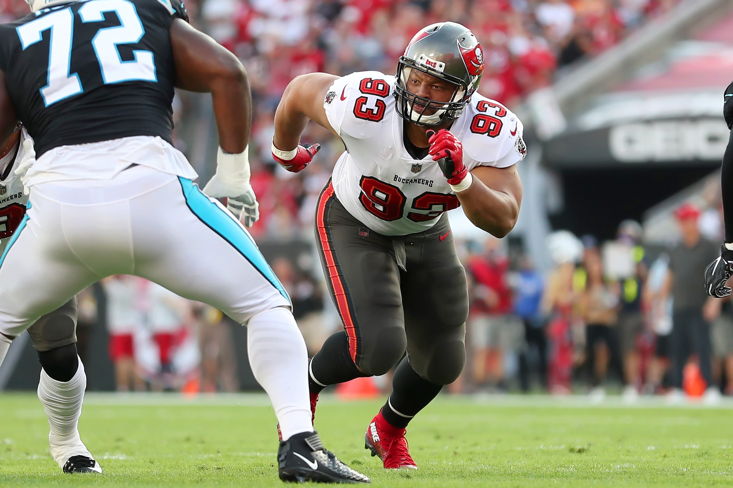 TAMPA, FL - JANUARY 9: Tampa Bay Buccaneers Defensive End Ndamukong Suh (93) rushes the passer during the regular season game between the Carolina Panthers and the Tampa Bay Buccaneers on January 9, 2022 at Raymond James Stadium in Tampa, Florida. (Photo by Cliff Welch/Icon Sportswire via Getty Images) TAMPA, FL - JANUARY 9: Tampa Bay Buccaneers Defensive End Ndamukong Suh (93) rushes the passer during the regular season game between the Carolina Panthers and the Tampa Bay Buccaneers on January 9, 2022 at Raymond James Stadium in Tampa, Florida. (Photo by Cliff Welch/Icon Sportswire via Getty Images)