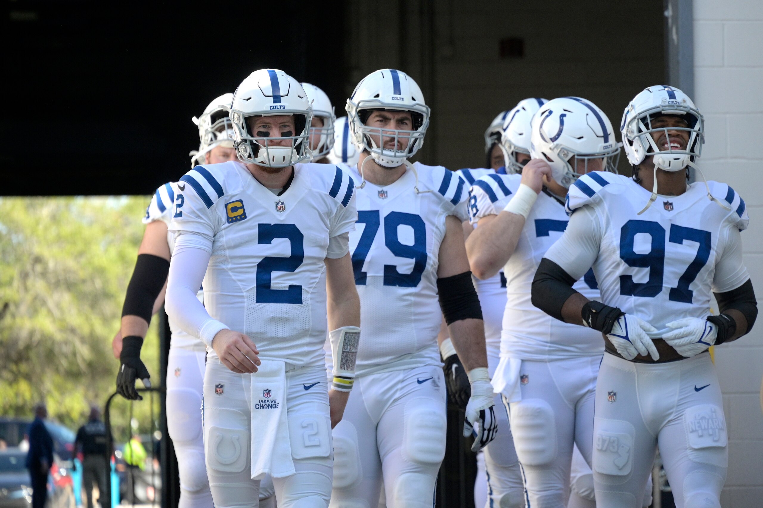 Indianapolis Colts quarterback Carson Wentz (2) leads teammates onto the field before an NFL football game against the Jacksonville Jaguars, Sunday, Jan. 9, 2022, in Jacksonville, Fla. (AP Photo/Phelan M. Ebenhack)