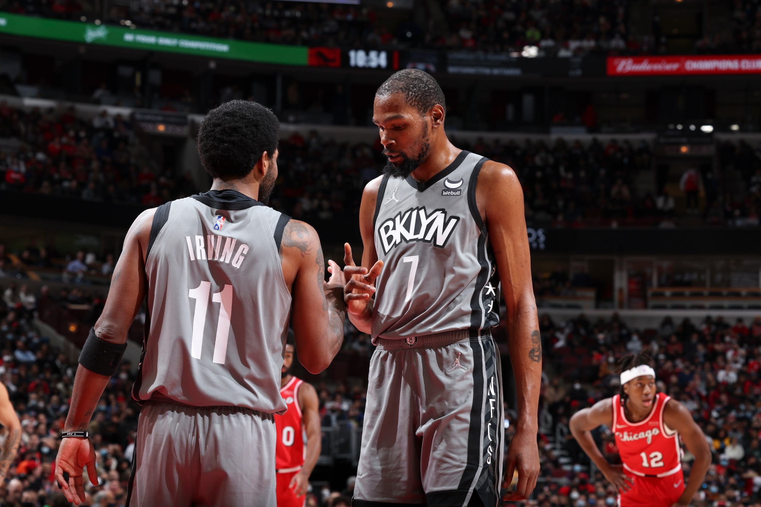 CHICAGO, IL - JANUARY 12: Kyrie Irving #11 of the Brooklyn Nets talks to Kevin Durant #7 of the Brooklyn Nets during the game against the Chicago Bulls on January 12, 2022 at United Center in Chicago, Illinois. NOTE TO USER: User expressly acknowledges and agrees that, by downloading and or using this photograph, User is consenting to the terms and conditions of the Getty Images License Agreement. Mandatory Copyright Notice: Copyright 2022 NBAE (Photo by Jeff Haynes/NBAE via Getty Images)