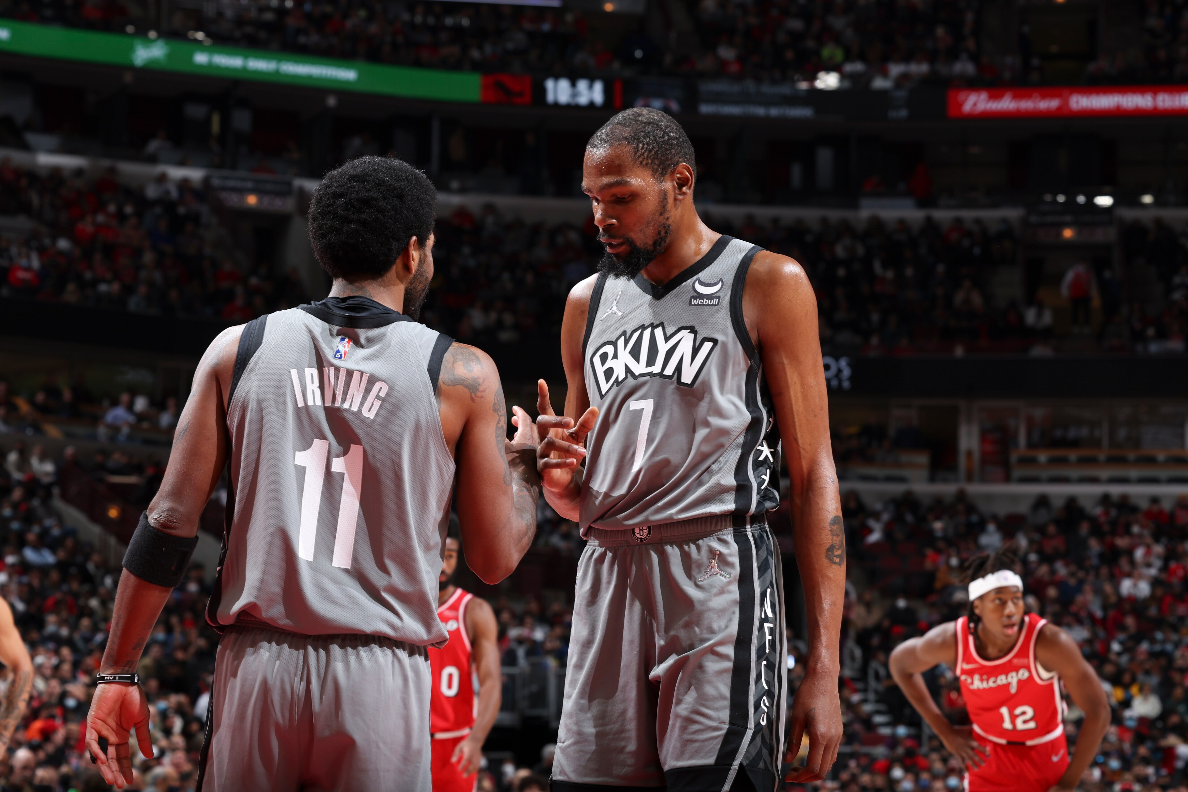 CHICAGO, IL - JANUARY 12: Kyrie Irving #11 of the Brooklyn Nets talks to Kevin Durant #7 of the Brooklyn Nets during the game against the Chicago Bulls on January 12, 2022 at United Center in Chicago, Illinois. NOTE TO USER: User expressly acknowledges and agrees that, by downloading and or using this photograph, User is consenting to the terms and conditions of the Getty Images License Agreement. Mandatory Copyright Notice: Copyright 2022 NBAE (Photo by Jeff Haynes/NBAE via Getty Images)