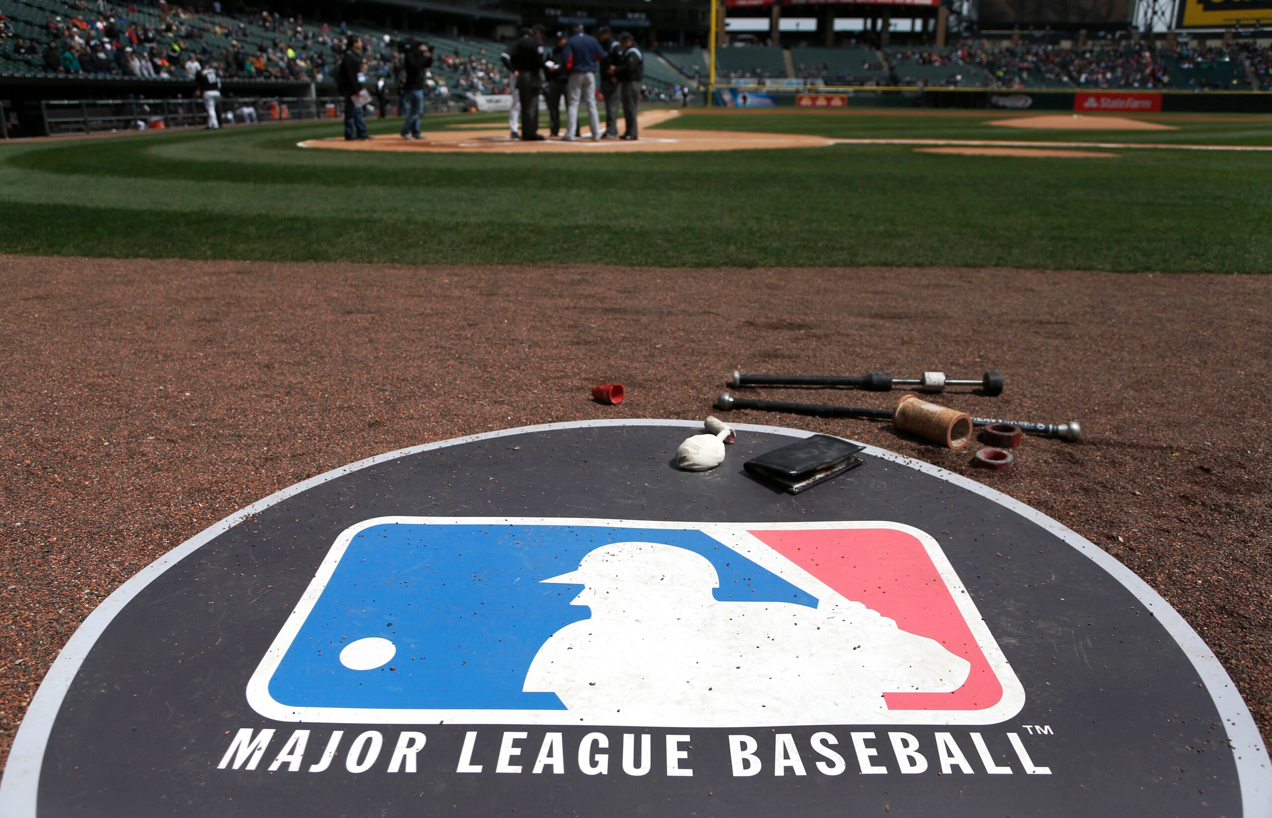 The Major League Baseball logo serves as the visitor's on deck circle before a baseball game between the Chicago White Sox and the Cleveland Indians Wednesday, April 24, 2013, in Chicago. (AP Photo/Charles Rex Arbogast) The Major League Baseball logo serves as the visitor's on deck circle before a baseball game between the Chicago White Sox and the Cleveland Indians Wednesday, April 24, 2013, in Chicago. (AP Photo/Charles Rex Arbogast)