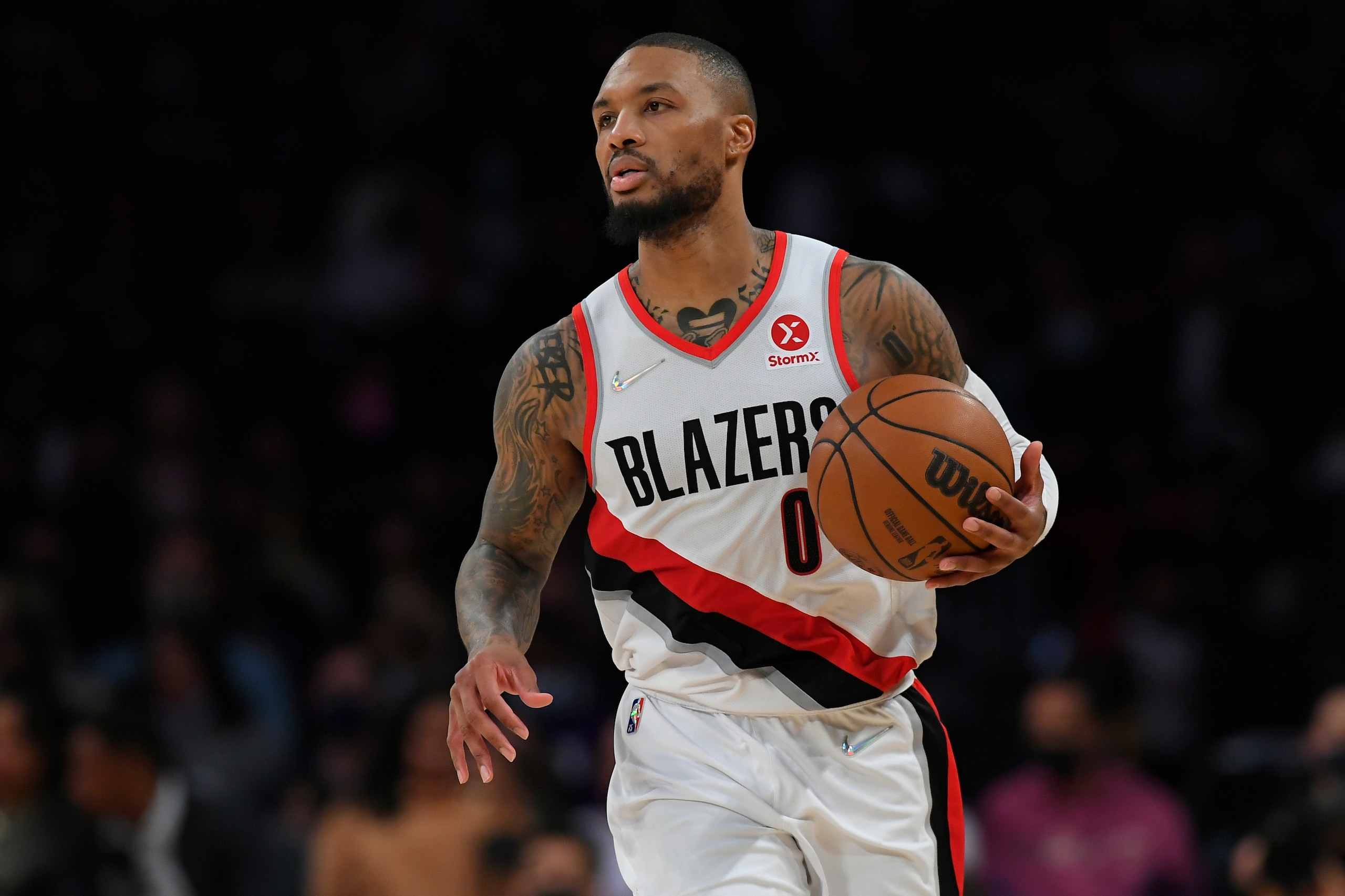 Portland Trail Blazers guard Damian Lillard (0) seen playing the Los Angeles Lakers in an NBA basketball game, Friday Dec. 31, 2021, in Los Angeles. (AP Photo/John McCoy)
