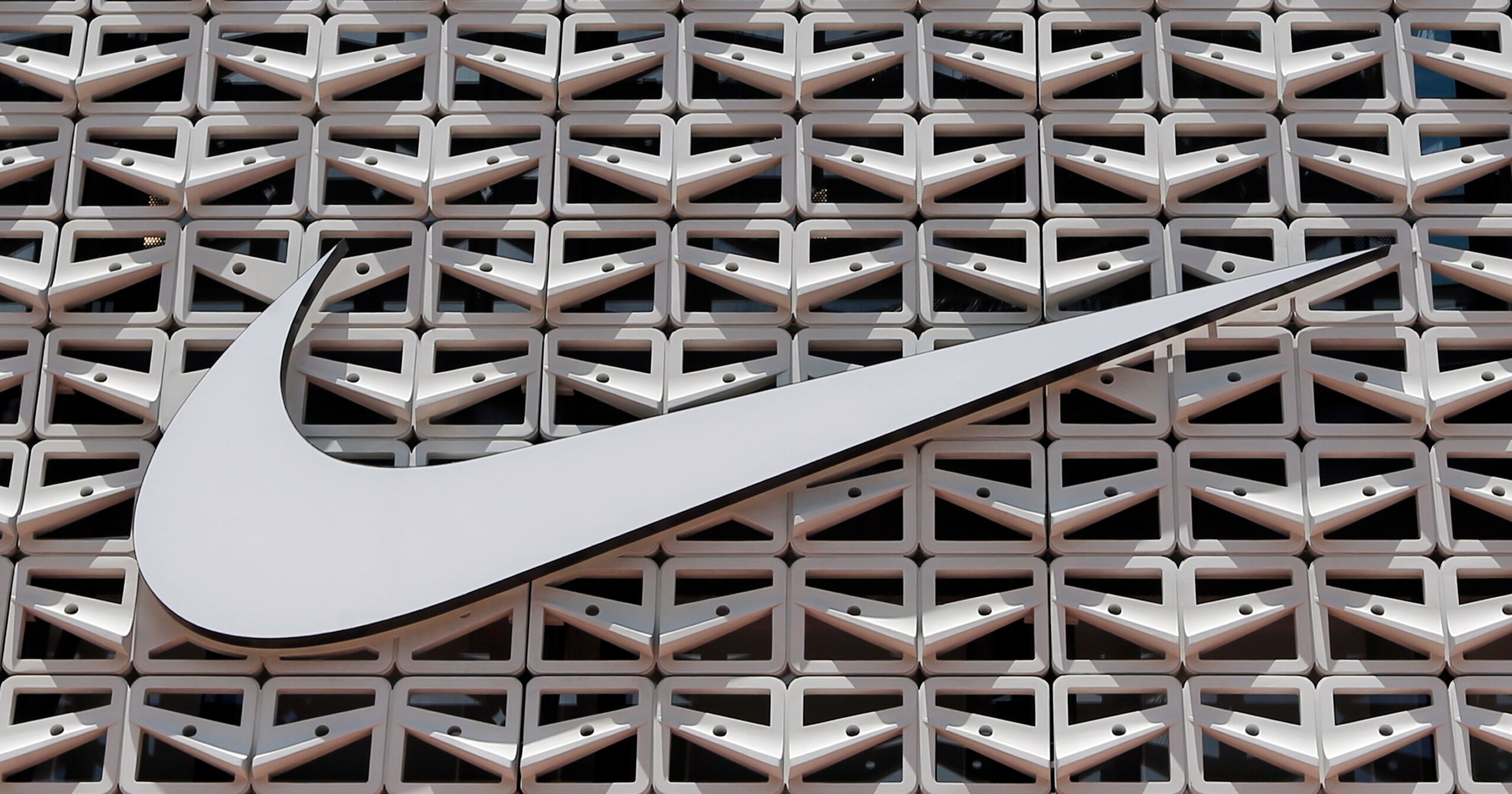 This Tuesday, Aug. 8, 2017, photo shows the Nike logo at a store in Miami Beach, Fla. Nike Inc. reports earnings Thursday, Dec. 21, 2017. (AP Photo/Alan Diaz) This Tuesday, Aug. 8, 2017, photo shows the Nike logo at a store in Miami Beach, Fla. Nike Inc. reports earnings Thursday, Dec. 21, 2017. (AP Photo/Alan Diaz)