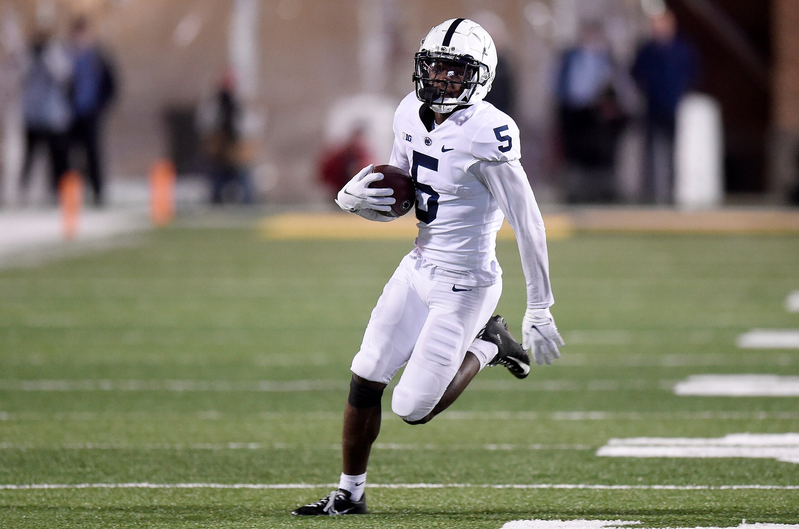 COLLEGE PARK, MARYLAND - NOVEMBER 06: Jahan Dotson #5 of the Penn State Nittany Lions runs with the ball after making a catch against the Maryland Terrapins at Capital One Field at Maryland Stadium on November 06, 2021 in College Park, Maryland. (Photo by G Fiume/Getty Images)