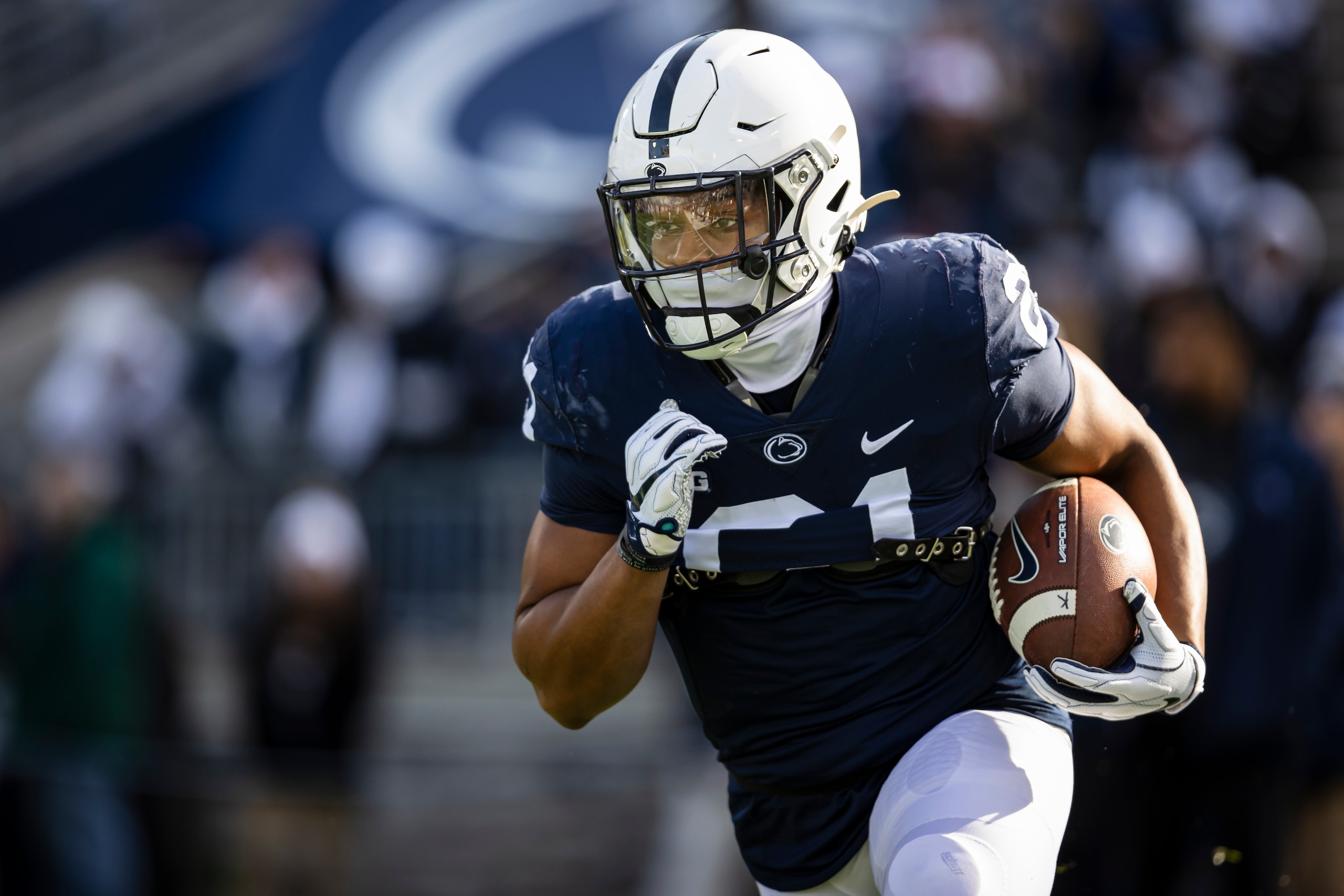 STATE COLLEGE, PA - NOVEMBER 20: Noah Cain #21 of the Penn State Nittany Lions warms up before the game against the Rutgers Scarlet Knights at Beaver Stadium on November 20, 2021 in State College, Pennsylvania. (Photo by Scott Taetsch/Getty Images)