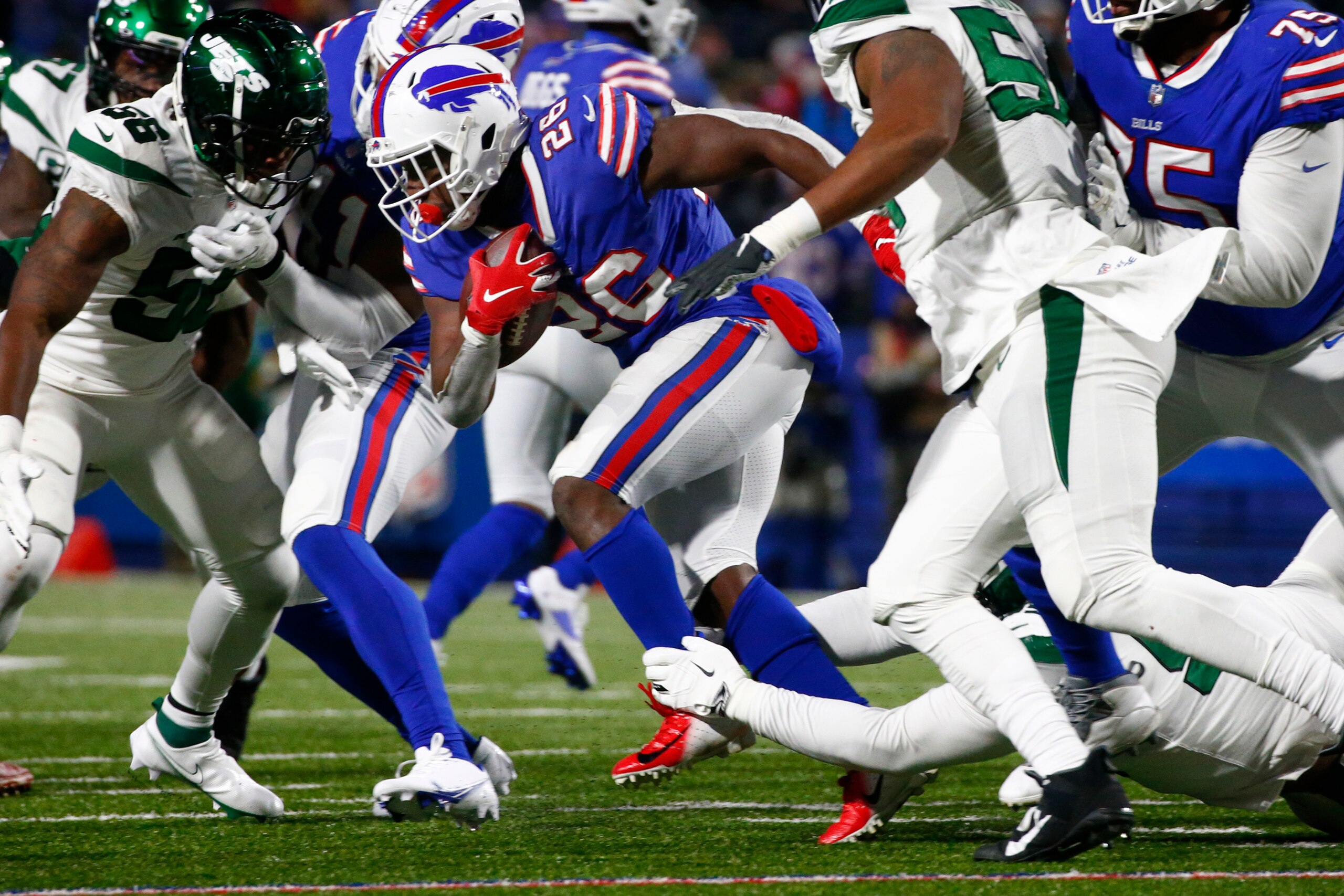 Buffalo Bills running back Devin Singletary (26) carries the ball during the first half of an NFL football game against the New York Jets in Orchard park, N.Y., Sunday Jan. 9, 2022. (AP/ Photo Jeffrey T. Barnes)