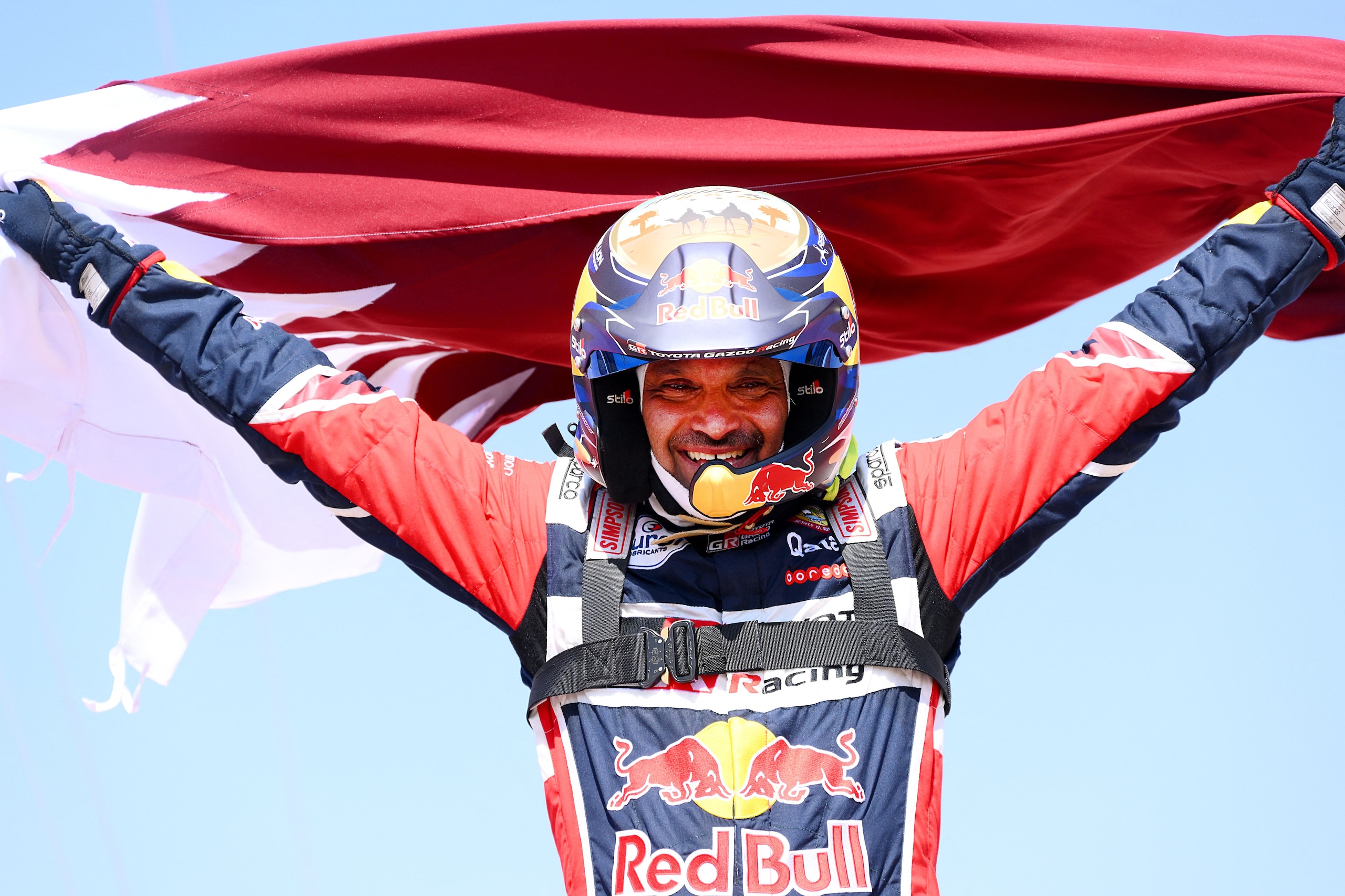 TOPSHOT - Toyota's driver Nasser Al-Attiyah of Qatar celebrates his victory after winning the Dakar Rally 2022, at the end of the last stage between Bisha and Jeddah in Saudi Arabia, on January 14, 2022. (Photo by FRANCK FIFE / AFP) (Photo by FRANCK FIFE/AFP via Getty Images)