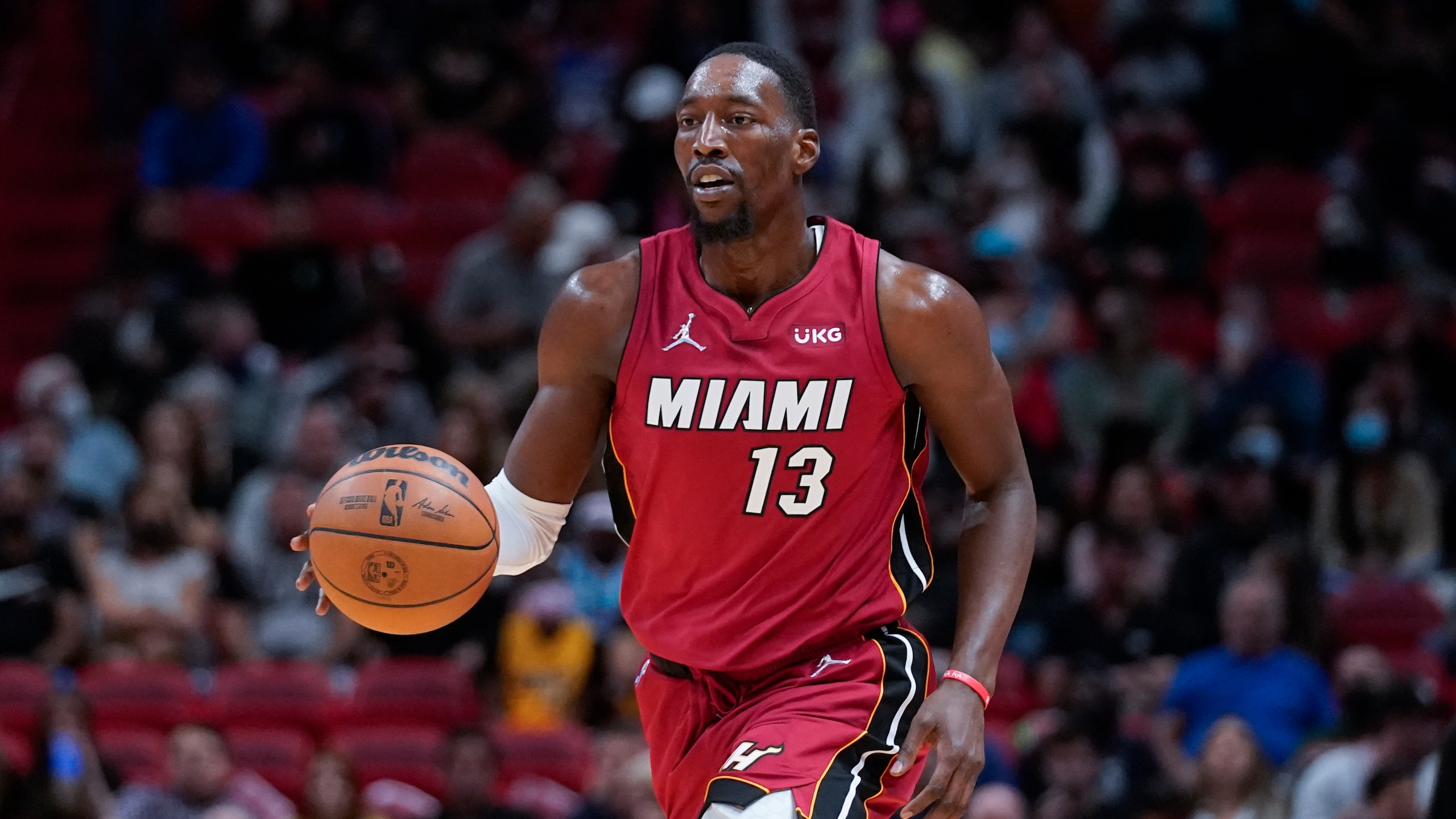 Miami Heat center Bam Adebayo takes the ball down court during the second half of an NBA basketball game against the Denver Nuggets, Monday, Nov. 29, 2021, in Miami. (AP Photo/Wilfredo Lee)