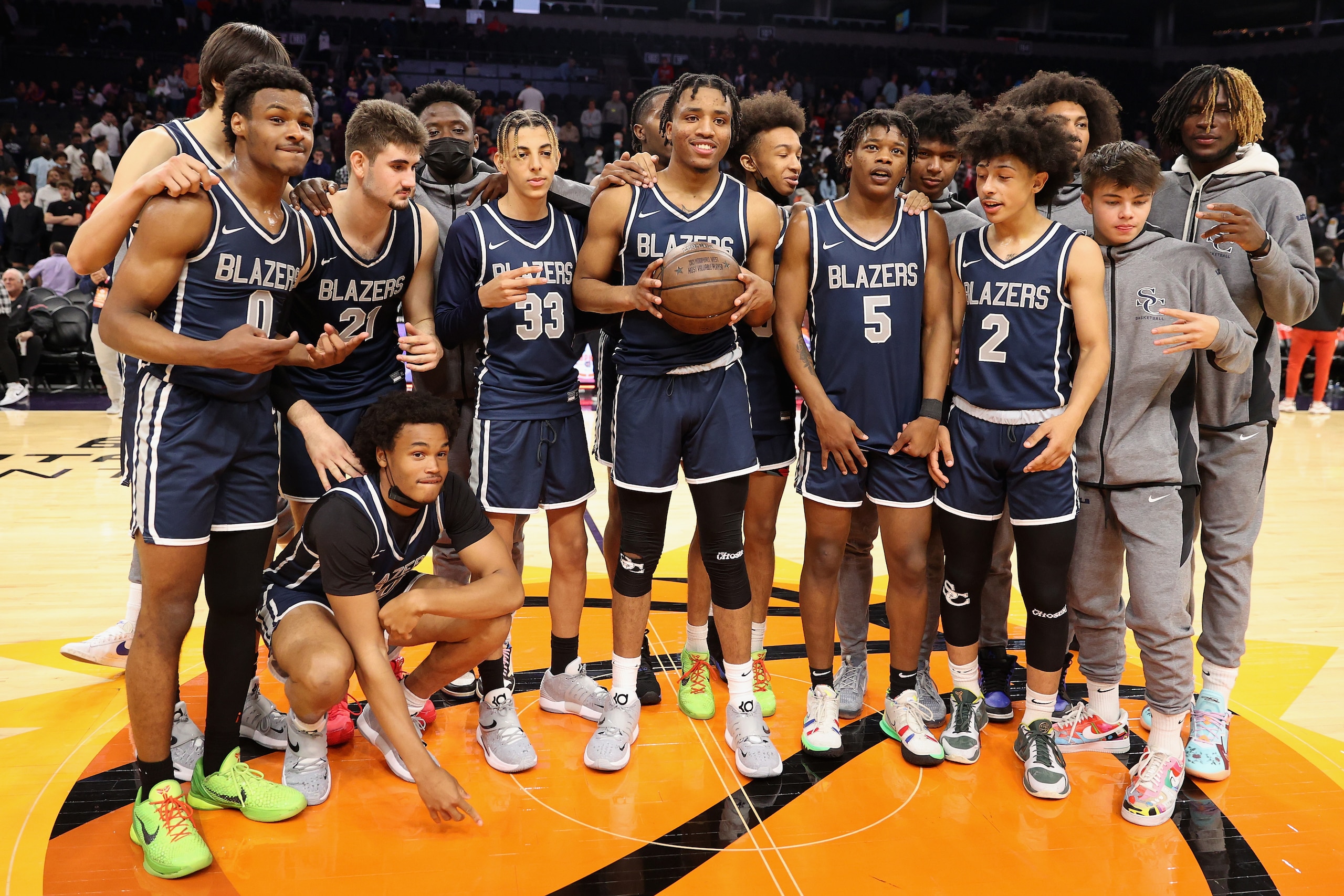 PHOENIX, ARIZONA - DECEMBER 11: (L-R) Bronny James #0, Evan Manjikian #21, Addison Reid #50, Justin Pippen #33, Ramel Lloyd Jr. #12, Mike Price #5 and Dylan Metoyer #2 of the Sierra Canyon Trailblazers pose together after defeating the Perry Pumas in the Hoophall West tournament at Footprint Center on December 11, 2021 in Phoenix, Arizona. (Photo by Christian Petersen/Getty Images) PHOENIX, ARIZONA - DECEMBER 11: (L-R) Bronny James #0, Evan Manjikian #21, Addison Reid #50, Justin Pippen #33, Ramel Lloyd Jr. #12, Mike Price #5 and Dylan Metoyer #2 of the Sierra Canyon Trailblazers pose together after defeating the Perry Pumas in the Hoophall West tournament at Footprint Center on December 11, 2021 in Phoenix, Arizona. (Photo by Christian Petersen/Getty Images)