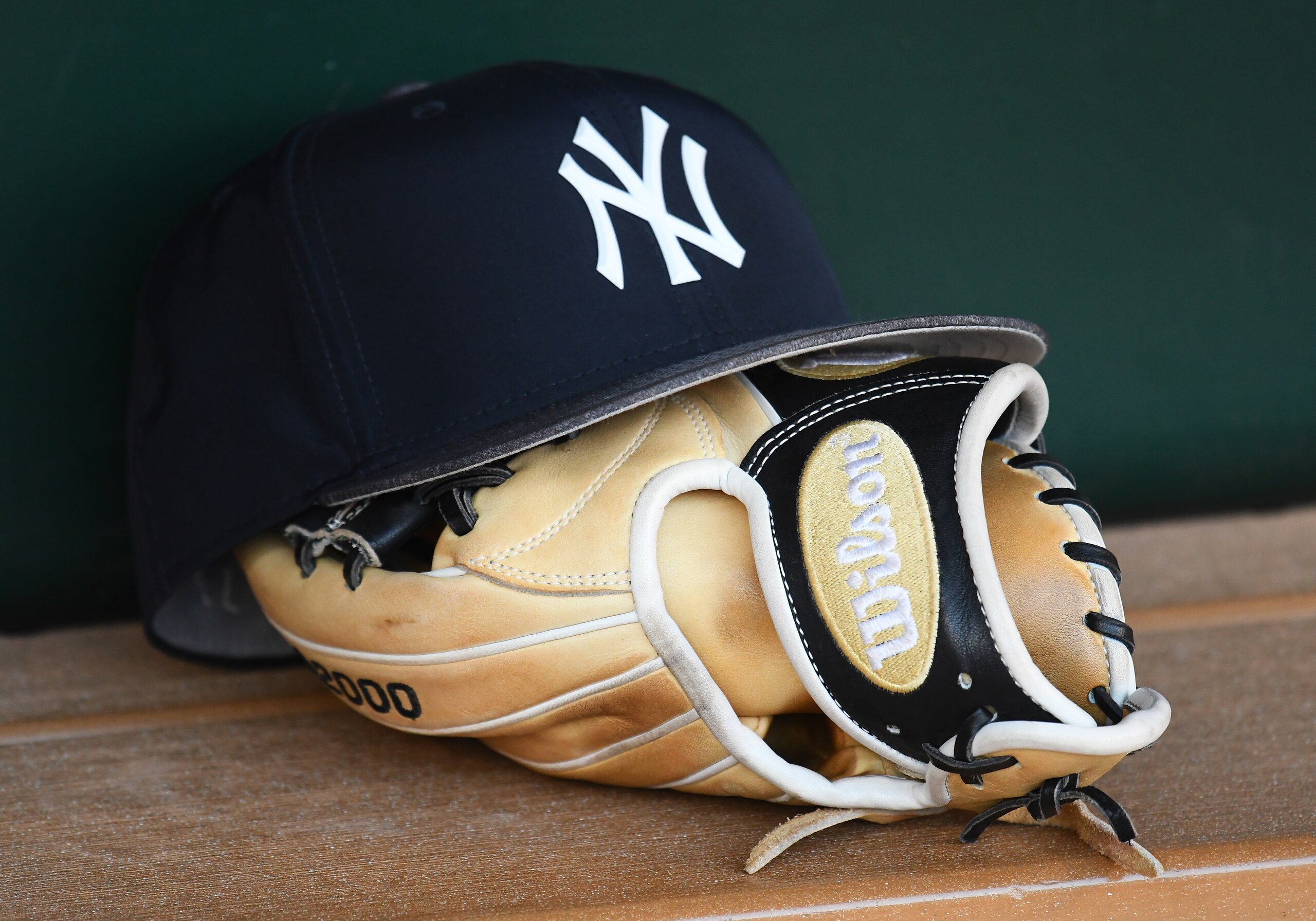 MINNEAPOLIS, MN - SEPTEMBER 12: A New York Yankees hat sits on a glove in the dugout before a MLB game between the Minnesota Twins and New York Yankees on September 12, 2018 at Target Field in Minneapolis, MN. The Twins defeated the Yankees 3-1.(Photo by Nick Wosika/Icon Sportswire via Getty Images)