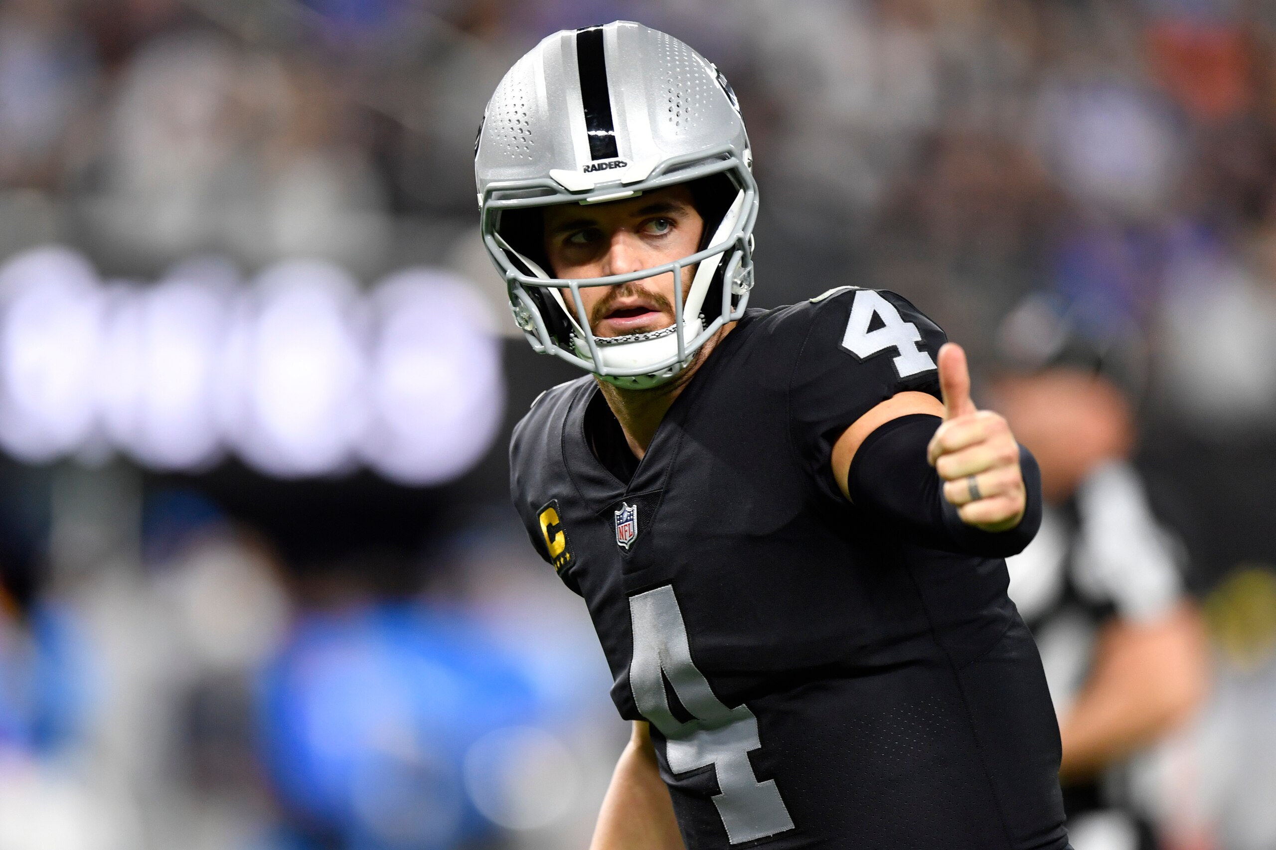LAS VEGAS, NEVADA - JANUARY 09:  Quarterback Derek Carr #4 of the Las Vegas Raiders lines up for a play against the Los Angeles Chargers during the first half of a game at Allegiant Stadium on January 09, 2022 in Las Vegas, Nevada. The Raiders defeated the Chargers 35-32 in overtime. (Photo by Chris Unger/Getty Images)