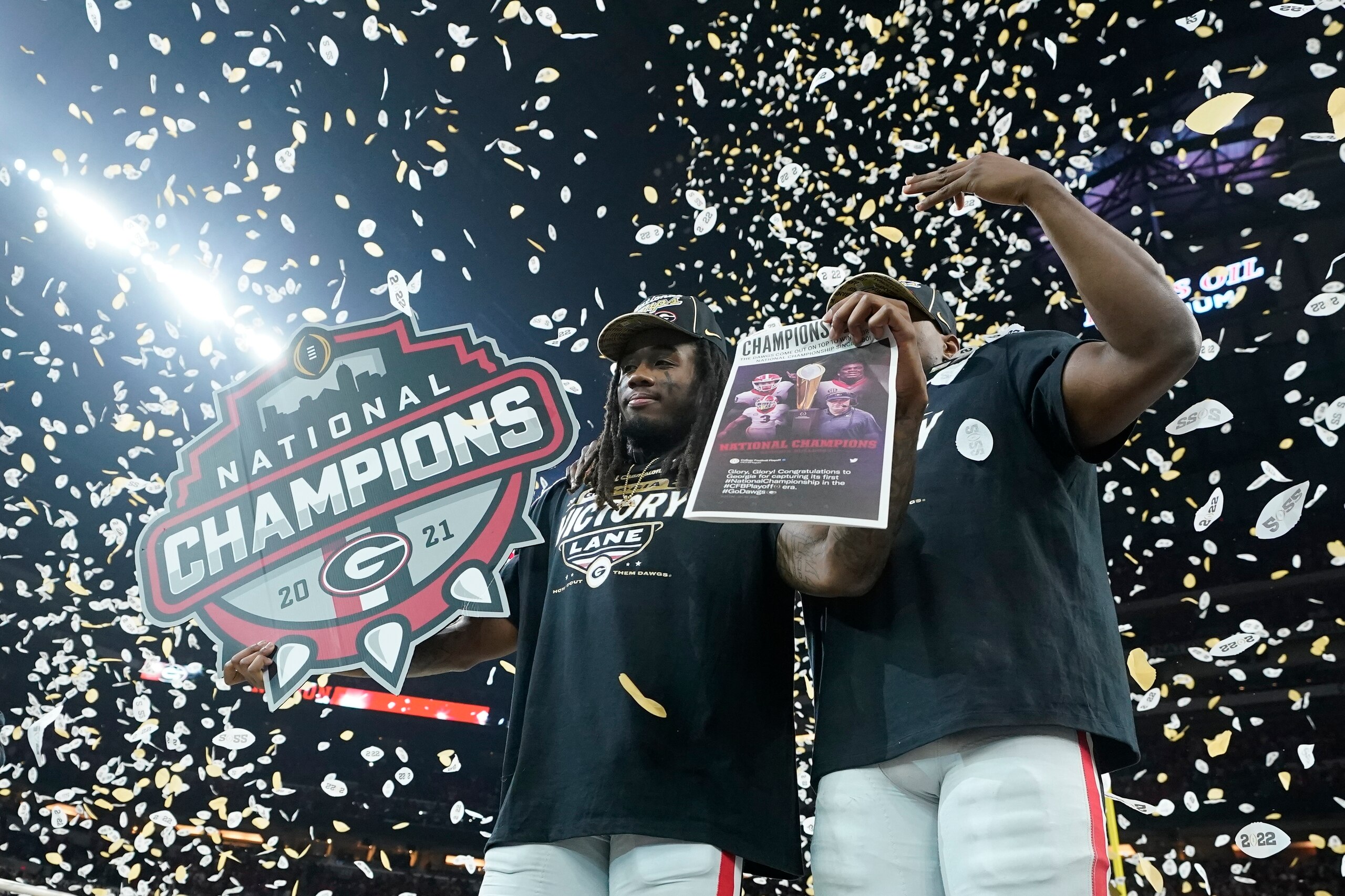 Georgia players celebrate after the College Football Playoff championship football game Tuesday, Jan. 11, 2022, in Indianapolis. Georgia won 33-18. (AP Photo/Darron Cummings) Georgia players celebrate after the College Football Playoff championship football game Tuesday, Jan. 11, 2022, in Indianapolis. Georgia won 33-18. (AP Photo/Darron Cummings)