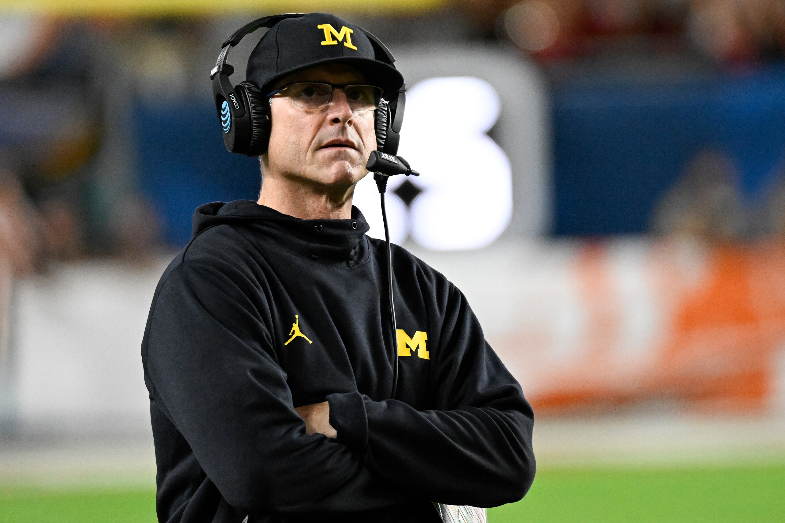 MIAMI GARDENS, FL - DECEMBER 31: Michigan Wolverines head coach Jim Harbaugh watches from the sidelines during the College Football Playoff Semifinal game between the Georgia Bulldogs and the Michigan Wolverines at the Capital One Orange Bowl on December 31, 2021 at the Hard Rock Stadium in Miami Gardens, FL.  (Photo by Doug Murray/Icon Sportswire via Getty Images)