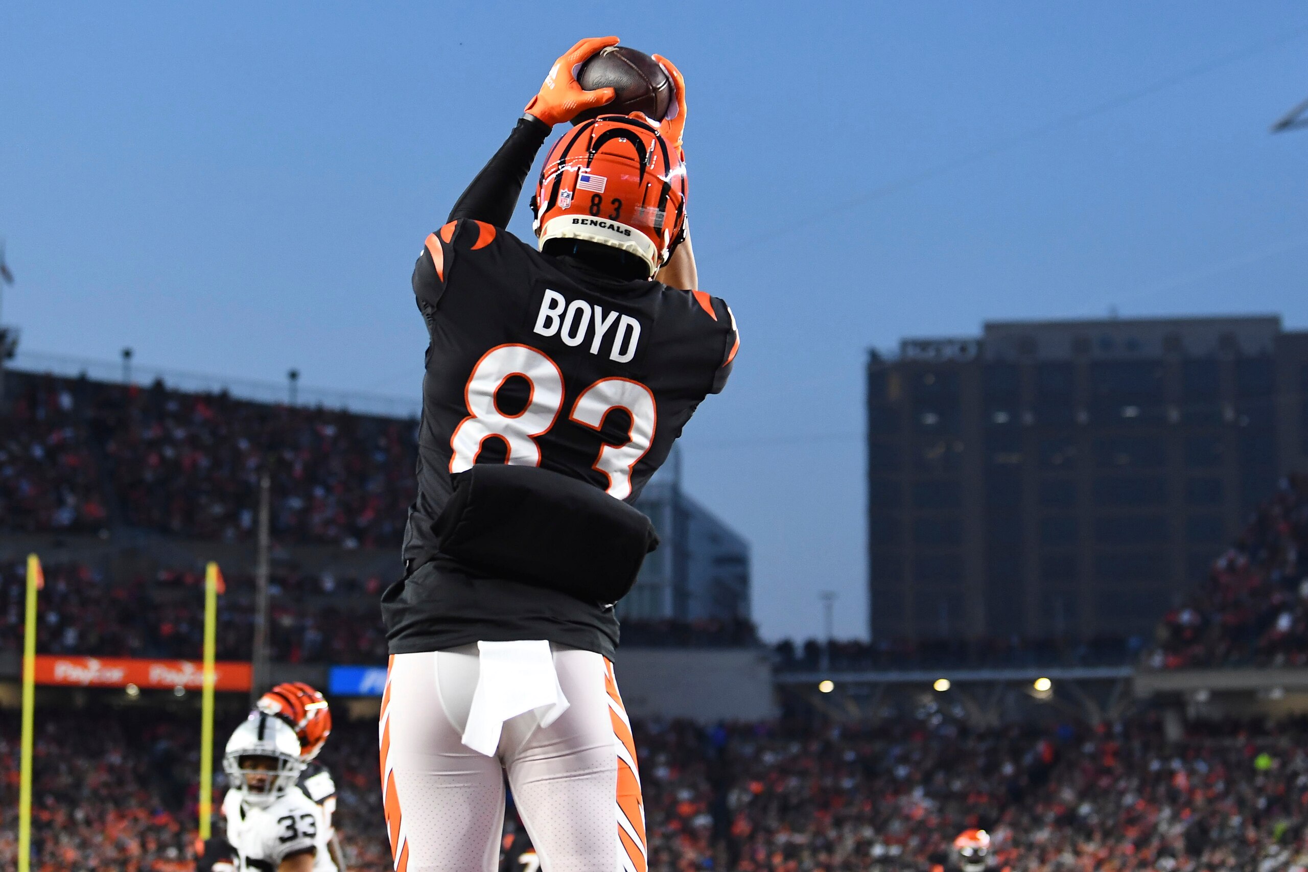 Cincinnati Bengals wide receiver Tyler Boyd (83) catches a pass for a touchdown in the second quarter during an NFL wild-card playoff football game against the Las Vegas Raiders, Saturday, Jan. 15, 2022, in Cincinnati. (AP Photo/Emilee Chinn)