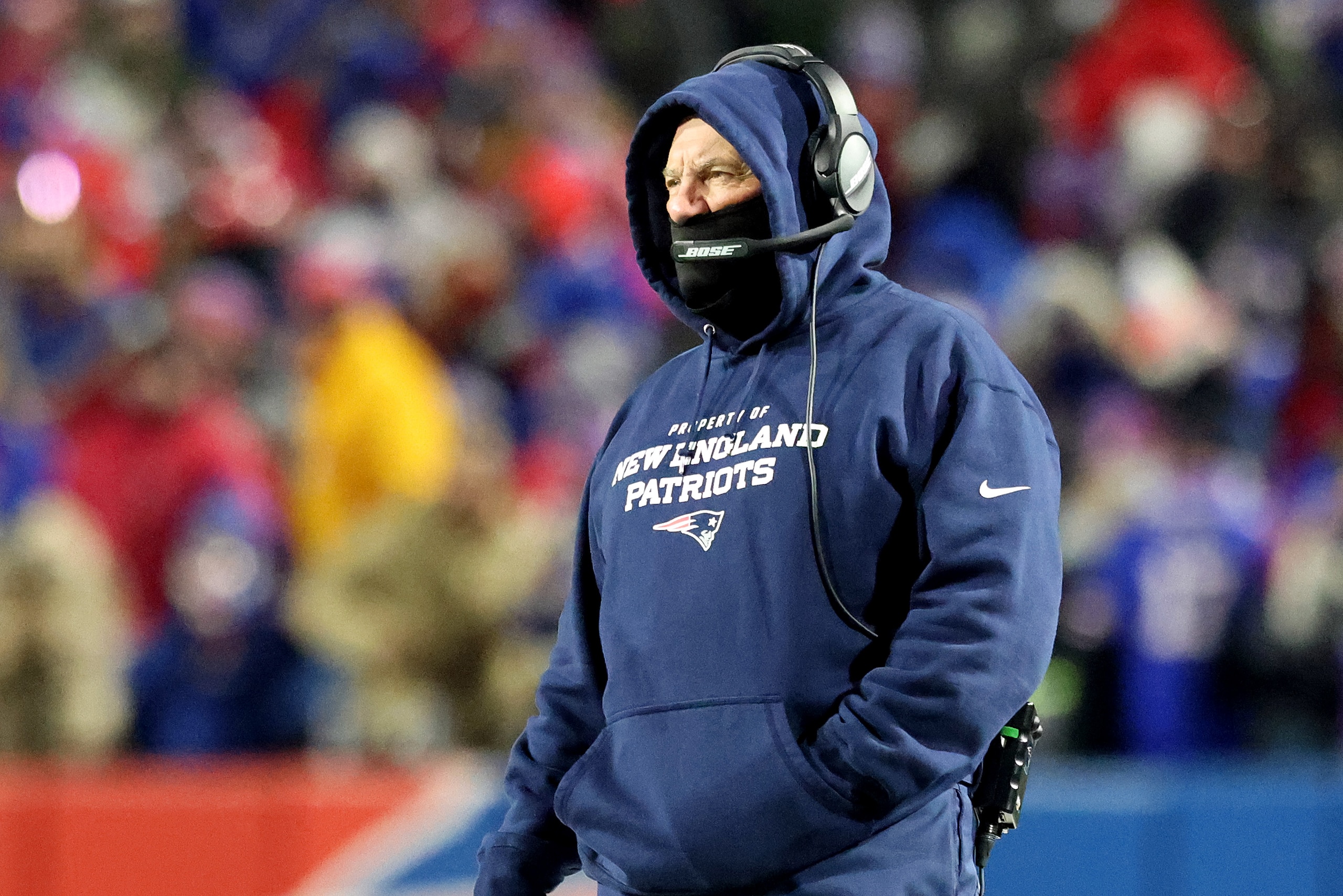 BUFFALO, NEW YORK - JANUARY 15: Head coach Bill Belichick of the New England Patriots looks on against the Buffalo Bills during the first half in the AFC Wild Card playoff game at Highmark Stadium on January 15, 2022 in Buffalo, New York. (Photo by Bryan M. Bennett/Getty Images)