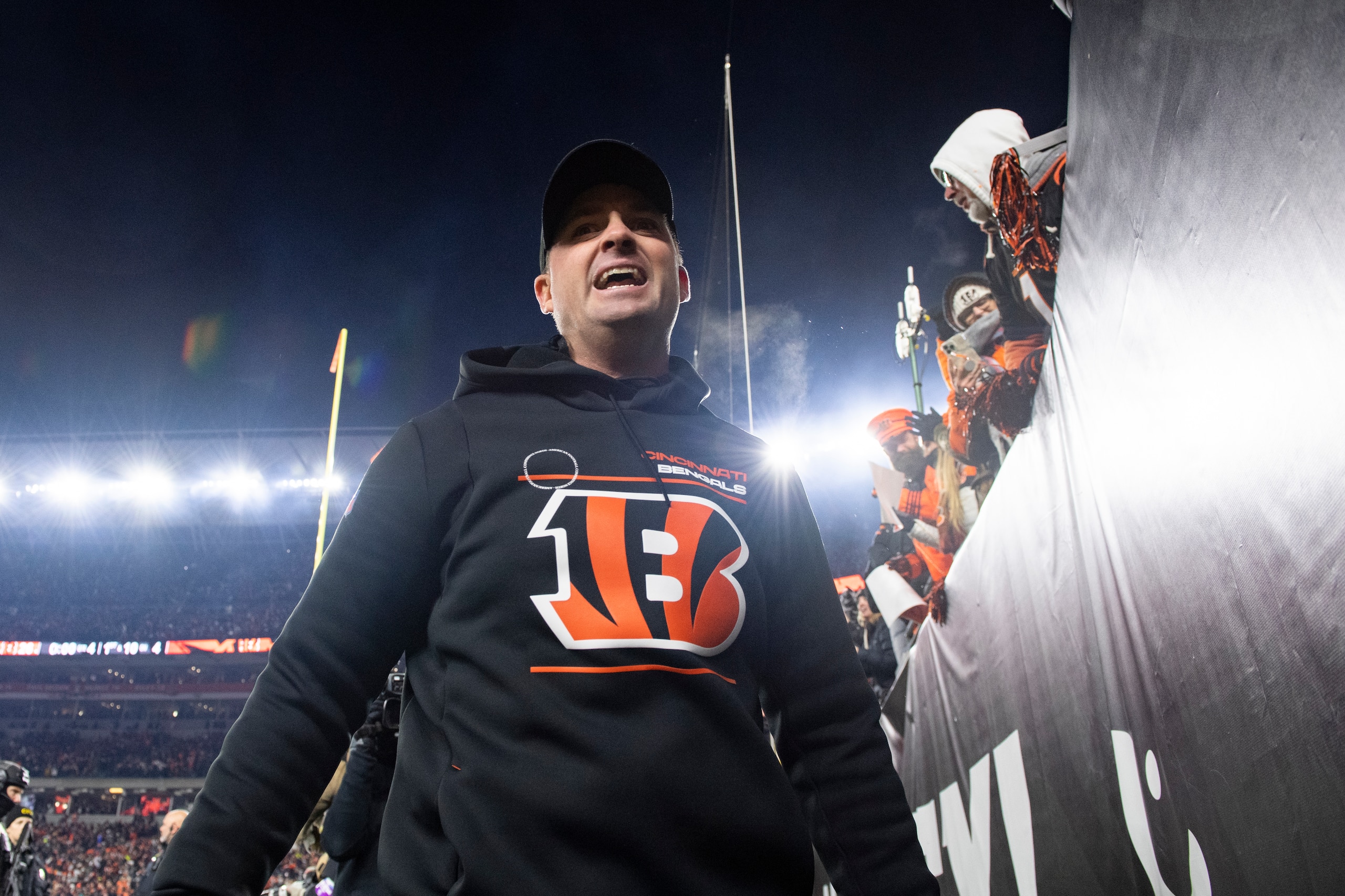 Cincinnati Bengals head coach Zac Taylor walks off the field after a win over the Las Vegas Raiders during an NFL wild-card playoff football game, Saturday, Jan. 15, 2022, in Cincinnati. (AP Photo/Emilee Chinn)