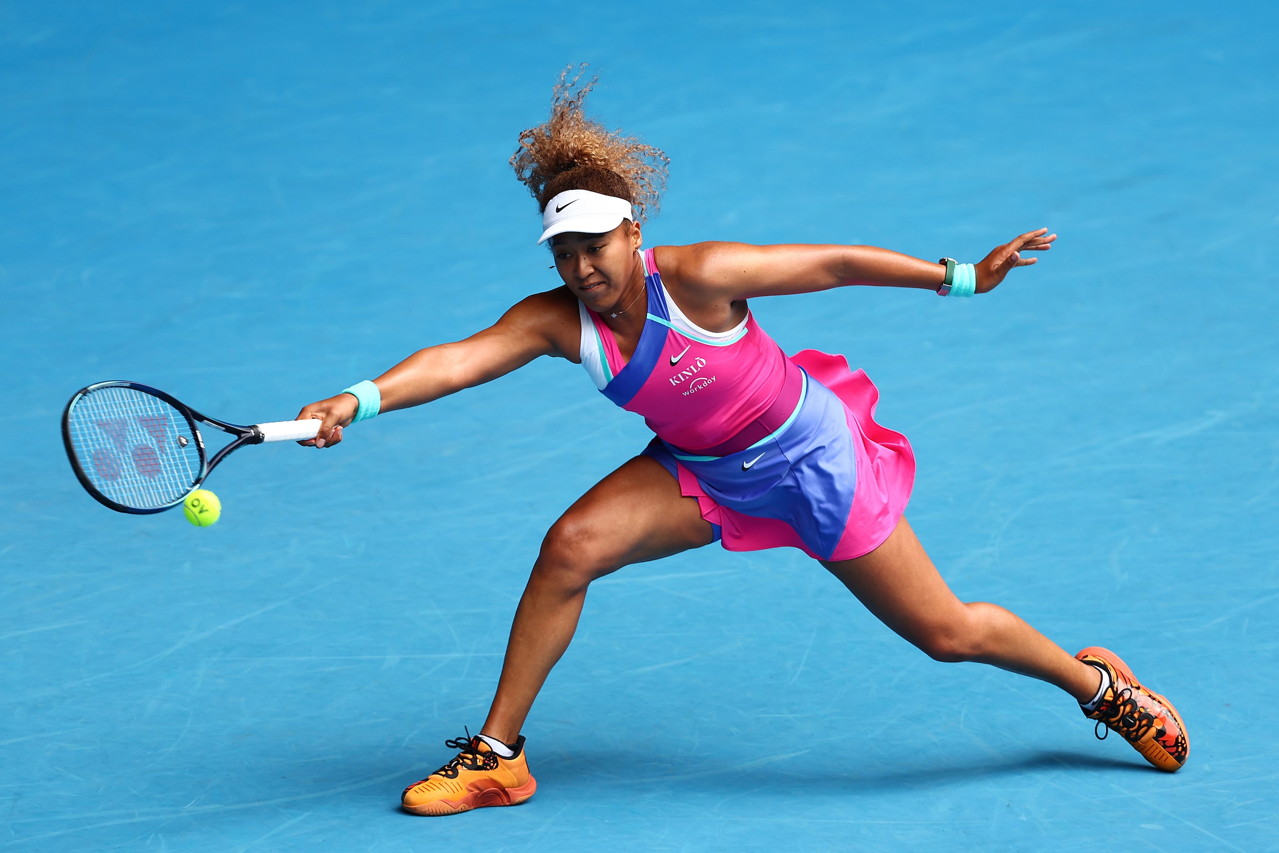 MELBOURNE, AUSTRALIA - JANUARY 17: Naomi Osaka of Japan plays a forehand in her first round singles match against Camila Osorio of Colombia during day one of the 2022 Australian Open at Melbourne Park on January 17, 2022 in Melbourne, Australia. (Photo by Clive Brunskill/Getty Images)