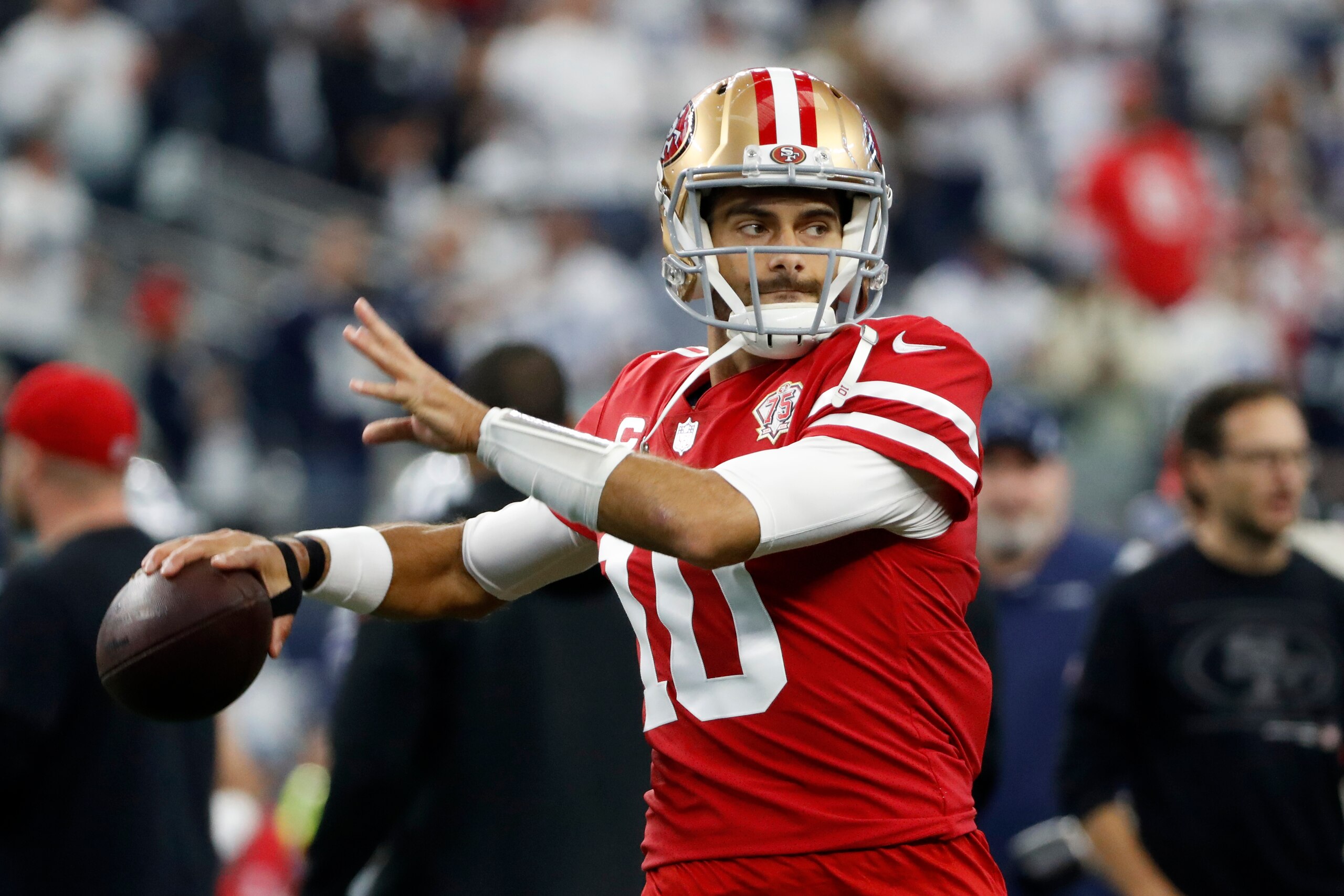 San Francisco 49ers quarterback Jimmy Garoppolo (10) warms up before an NFL wild-card playoff football game against the Dallas Cowboys in Arlington, Texas, Sunday, Jan. 16, 2022. (AP Photo/Roger Steinman)