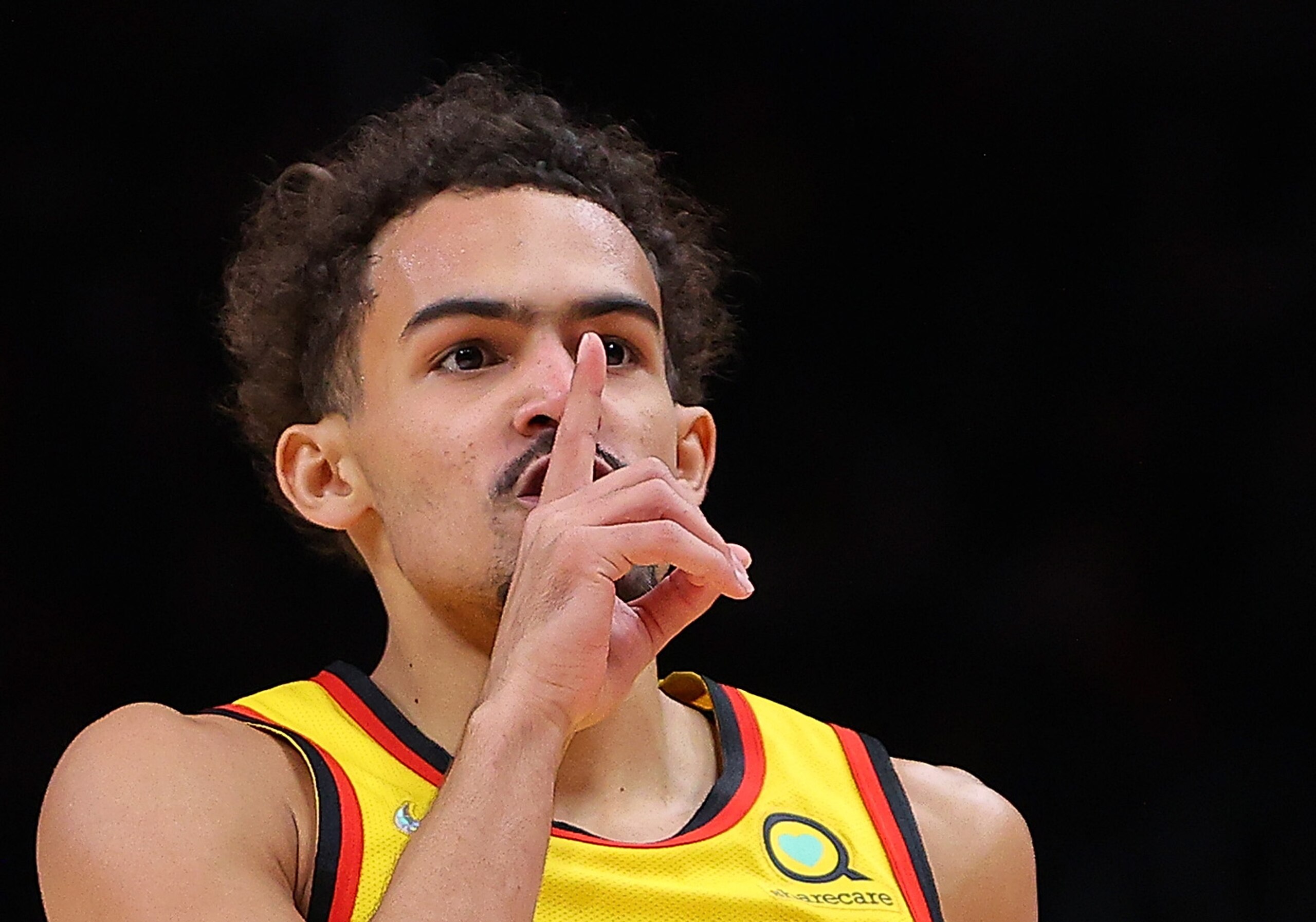 ATLANTA, GEORGIA - JANUARY 17:  Trae Young #11 of the Atlanta Hawks reacts after hitting a three-point basket against the Milwaukee Bucks during the first half at State Farm Arena on January 17, 2022 in Atlanta, Georgia.  NOTE TO USER: User expressly acknowledges and agrees that, by downloading and or using this photograph, User is consenting to the terms and conditions of the Getty Images License Agreement.  (Photo by Kevin C. Cox/Getty Images)