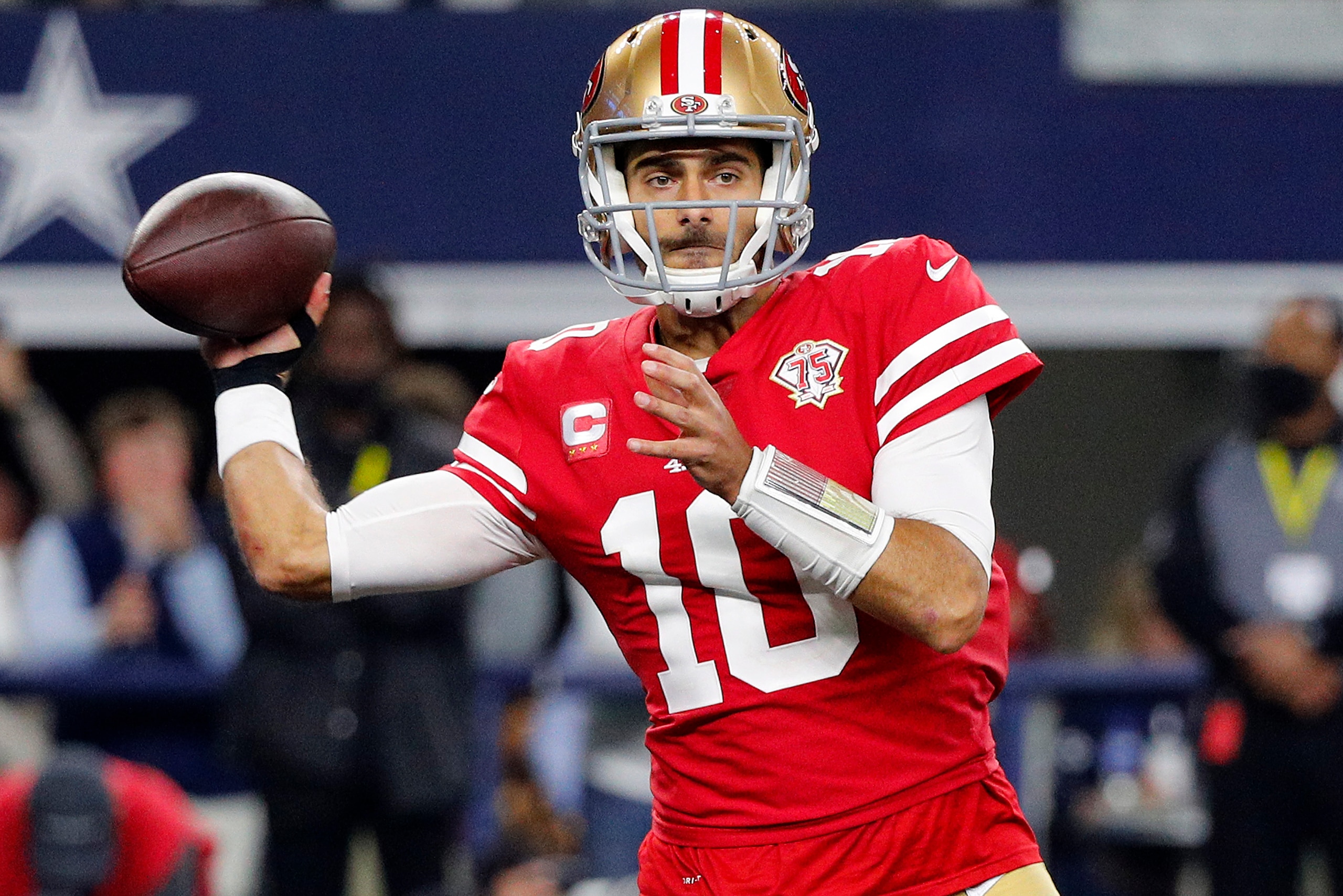 ARLINGTON, TEXAS - JANUARY 16: Jimmy Garoppolo #10 of the San Francisco 49ers throws a pass against the Dallas Cowboys during the second half in the NFC Wild Card Playoff game at AT&T Stadium on January 16, 2022 in Arlington, Texas. (Photo by Richard Rodriguez/Getty Images)