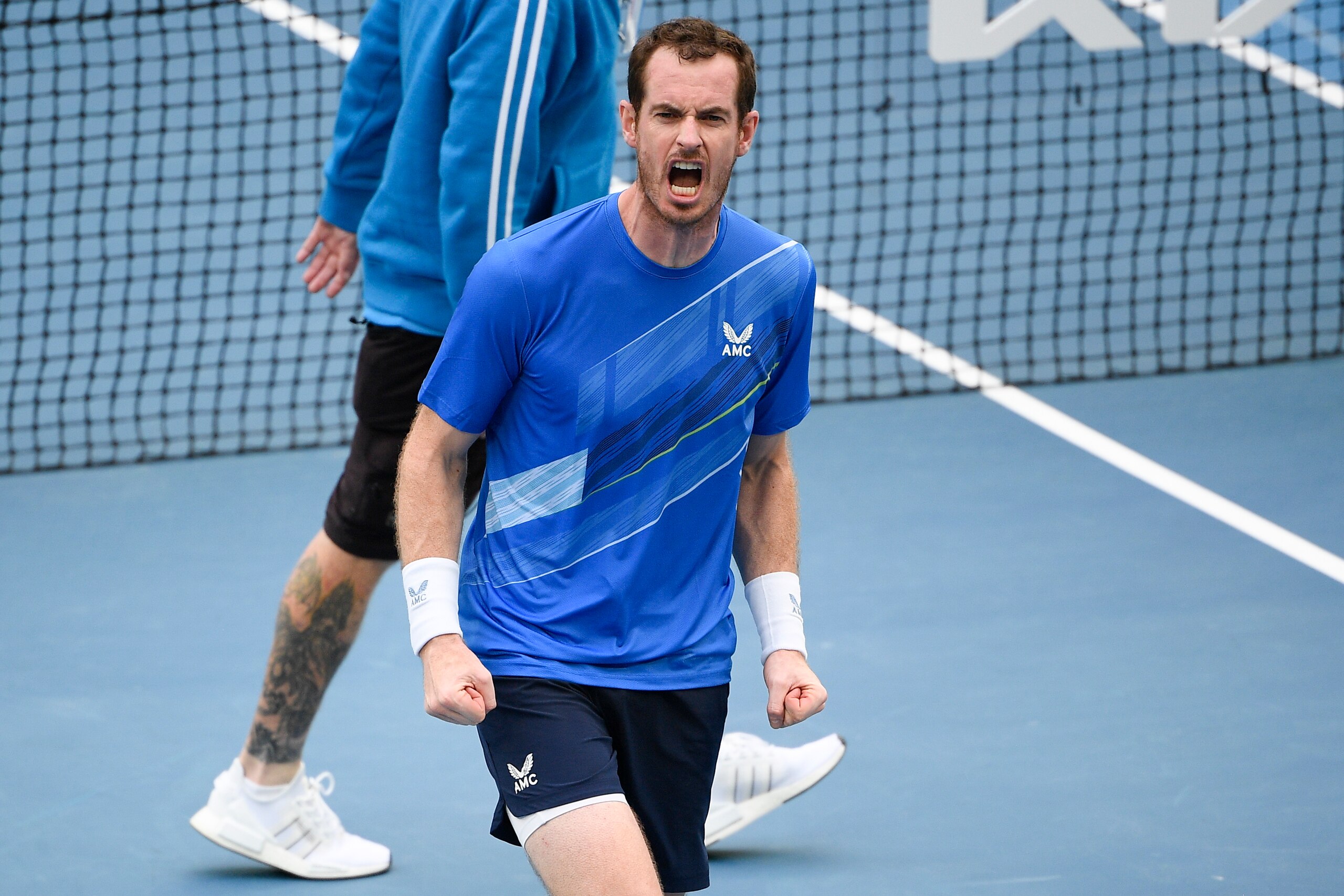 Andy Murray of Britain reacts after defeating Nikoloz Basilashvili of Georgia in their first round match at the Australian Open tennis championships in Melbourne, Australia, Tuesday, Jan. 18, 2022. (AP Photo/Andy Brownbill)