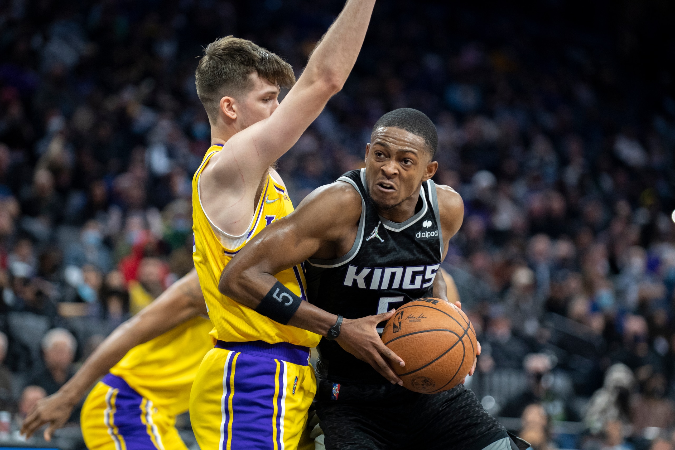 Sacramento Kings guard De'Aaron Fox (5) drives past Los Angeles Lakers guard Austin Reaves in the second half of an NBA basketball game in Sacramento, Calif., Wednesday, Jan. 12, 2022. The Kings won 125-116. (AP Photo/José Luis Villegas) Sacramento Kings guard De'Aaron Fox (5) drives past Los Angeles Lakers guard Austin Reaves in the second half of an NBA basketball game in Sacramento, Calif., Wednesday, Jan. 12, 2022. The Kings won 125-116. (AP Photo/José Luis Villegas)