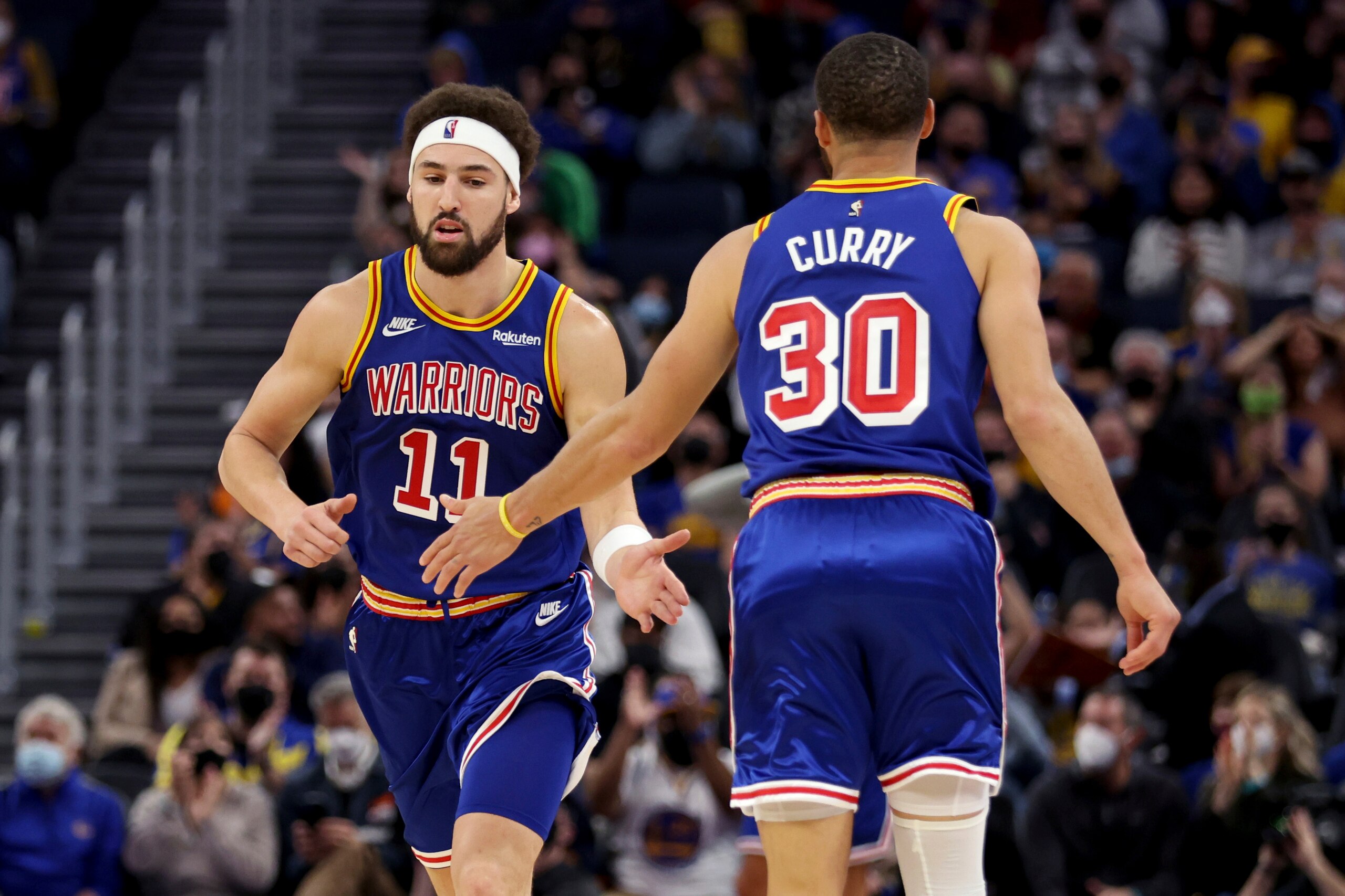 Golden State Warriors guard Klay Thompson (11) is congratulated by guard Stephen Curry (30) after Thompson scored against the Detroit Pistons during the first half of an NBA basketball game in San Francisco, Tuesday, Jan. 18, 2022. (AP Photo/Jed Jacobsohn) Golden State Warriors guard Klay Thompson (11) is congratulated by guard Stephen Curry (30) after Thompson scored against the Detroit Pistons during the first half of an NBA basketball game in San Francisco, Tuesday, Jan. 18, 2022. (AP Photo/Jed Jacobsohn)