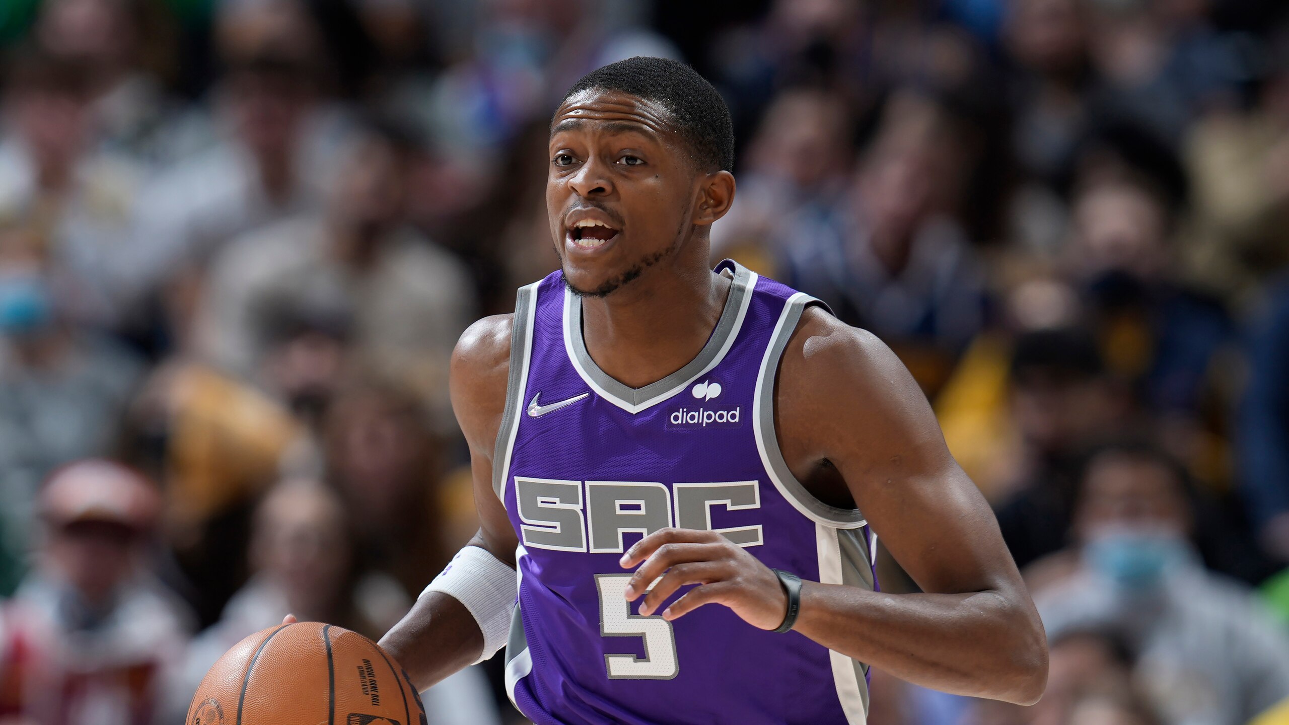 Sacramento Kings guard De'Aaron Fox (5) in the first half of an NBA basketball game Friday, Jan. 7, 2022, in Denver. (AP Photo/David Zalubowski)