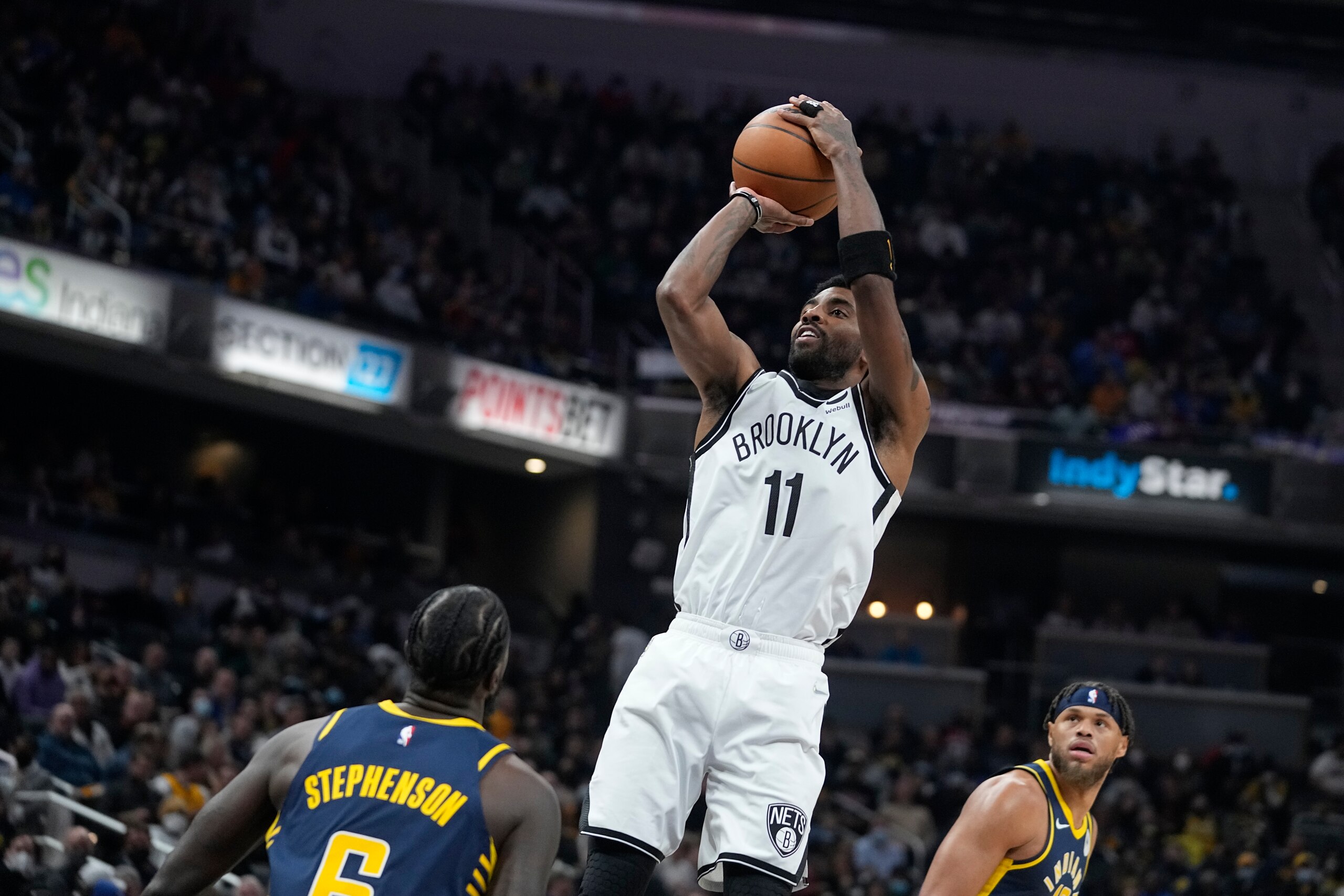 Brooklyn Nets' Kyrie Irving shoots during the first half of an NBA basketball game against the Indiana Pacers, Wednesday, Jan. 5, 2022, in Indianapolis. (AP Photo/Darron Cummings)