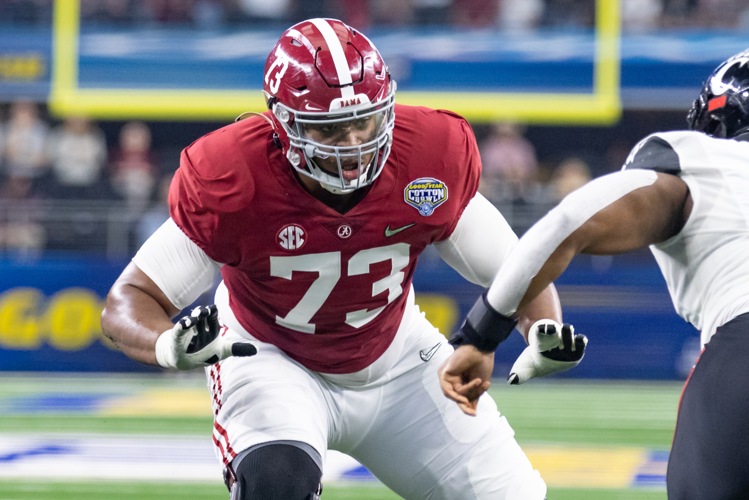 ARLINGTON, TX - DECEMBER 31: Alabama Crimson Tide offensive tackle Evan Neal (#73) blocks during the Goodyear Cotton Bowl CFP Semifinal college football game between the Alabama Crimson Tide and the Cincinnati Bearcats on December 31, 2021 at AT&T Stadium in Arlington, Texas.  (Photo by Matthew Visinsky/Icon Sportswire via Getty Images)