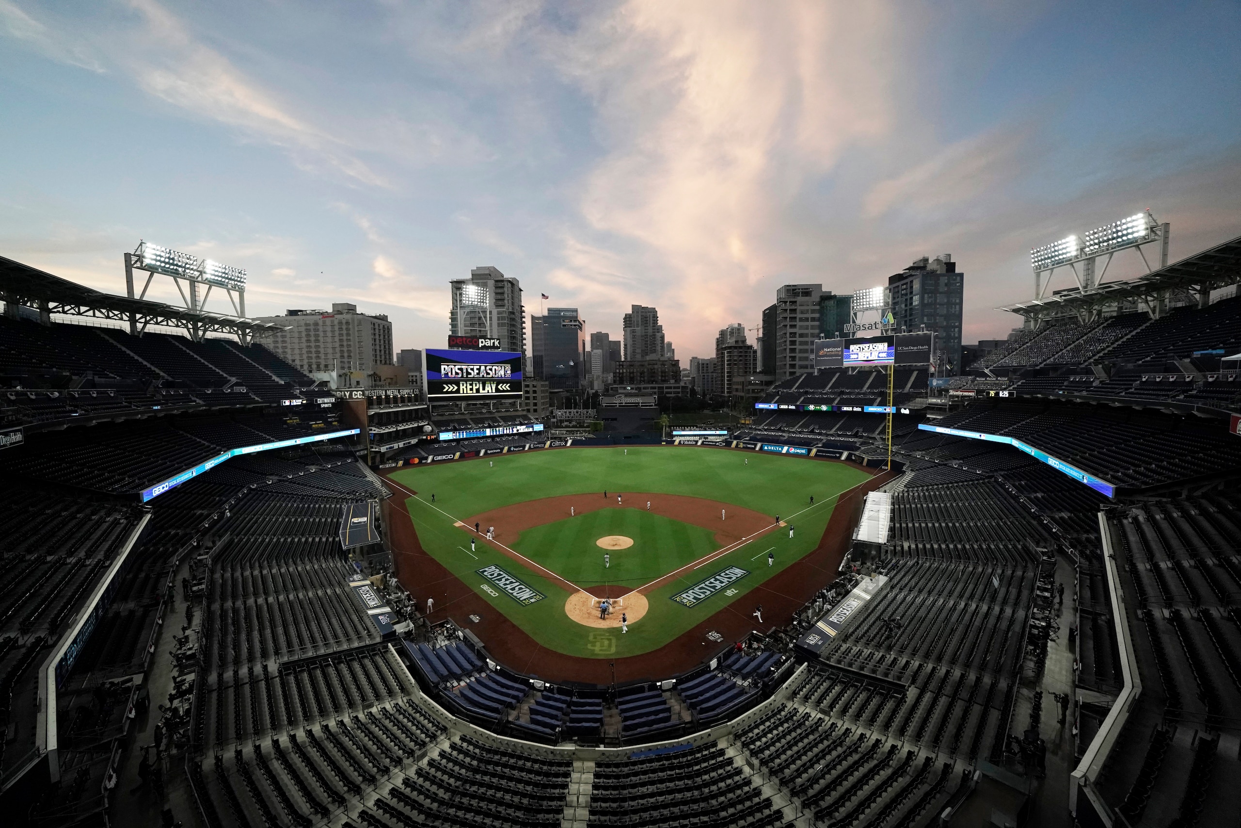 FILE - In this Oct. 6, 2020, file photo, the Tampa Bay Rays and the New York Yankees play in Game 2 of a baseball AL Division Series in an empty Petco Park in San Diego. Major League Baseball and all 30 of its teams are suing their insurance providers, citing billions of dollars in losses during the 2020 season played almost entirely without fans due to the coronavirus pandemic. The suit, filed in October in California Superior Court in Alameda County, was obtained Friday, Dec. 4, by The Associated Press. It says providers AIG, Factory Mutual and Interstate Fire and Casualty Company have refused to pay claims made by MLB despite the league's “all-risk” policy purchases. (AP Photo/Jae C. Hong, File) FILE - In this Oct. 6, 2020, file photo, the Tampa Bay Rays and the New York Yankees play in Game 2 of a baseball AL Division Series in an empty Petco Park in San Diego. Major League Baseball and all 30 of its teams are suing their insurance providers, citing billions of dollars in losses during the 2020 season played almost entirely without fans due to the coronavirus pandemic. The suit, filed in October in California Superior Court in Alameda County, was obtained Friday, Dec. 4, by The Associated Press. It says providers AIG, Factory Mutual and Interstate Fire and Casualty Company have refused to pay claims made by MLB despite the league's “all-risk” policy purchases. (AP Photo/Jae C. Hong, File)
