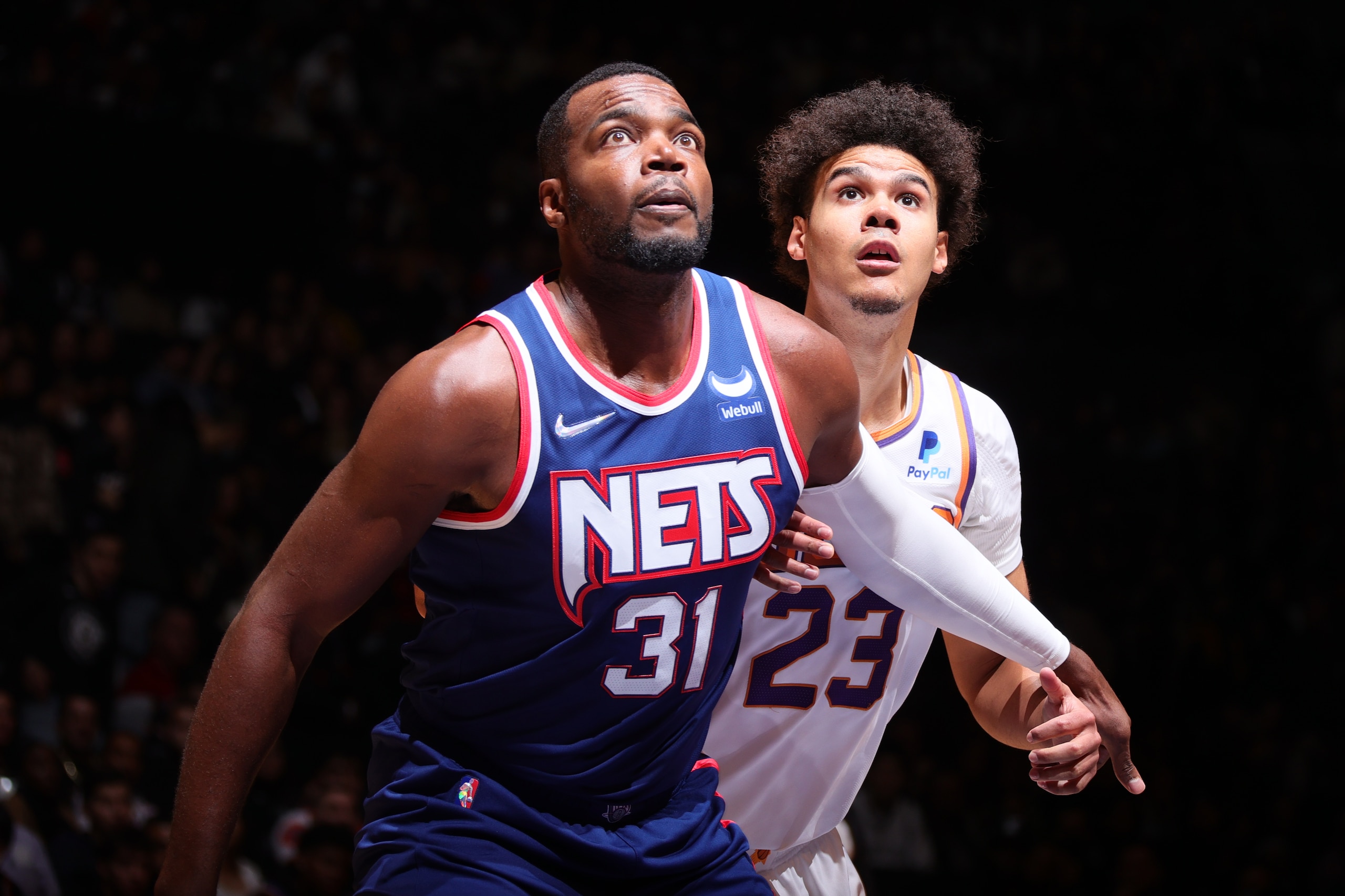 BROOKLYN, NY - NOVEMBER 27: Paul Millsap #31 of the Brooklyn Nets plays defense on Cameron Johnson #23 of the Phoenix Suns during the game on November 27, 2021 at Barclays Center in Brooklyn, New York. NOTE TO USER: User expressly acknowledges and agrees that, by downloading and or using this Photograph, user is consenting to the terms and conditions of the Getty Images License Agreement. Mandatory Copyright Notice: Copyright 2021 NBAE (Photo by Nathaniel S. Butler/NBAE via Getty Images)