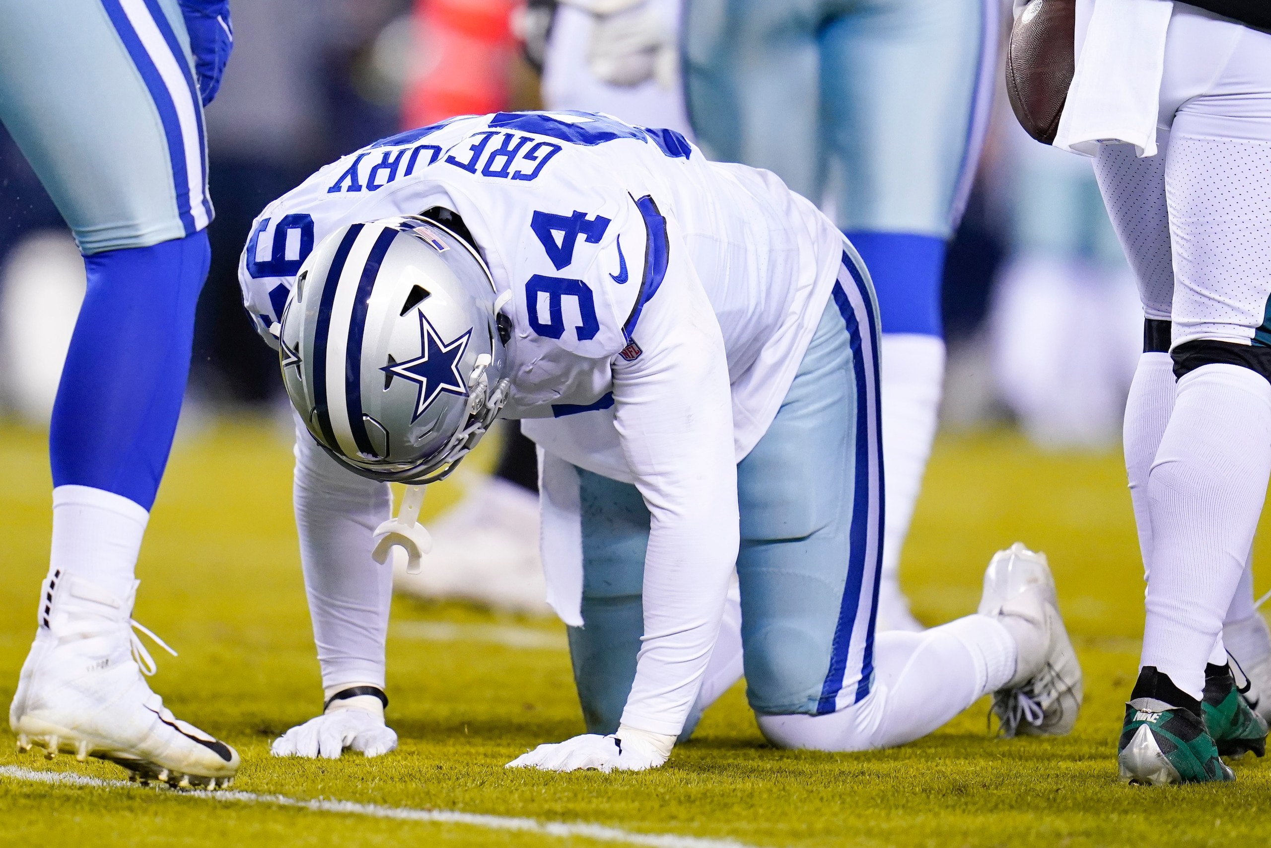 Dallas Cowboys defensive end Randy Gregory is slow to get up after a play during the first half of an NFL football game between the Philadelphia Eagles and the Dallas Cowboys, Monday, Jan. 10, 2022, in Philadelphia. The Cowboys won 51-26. (AP Photo/Julio Cortez)