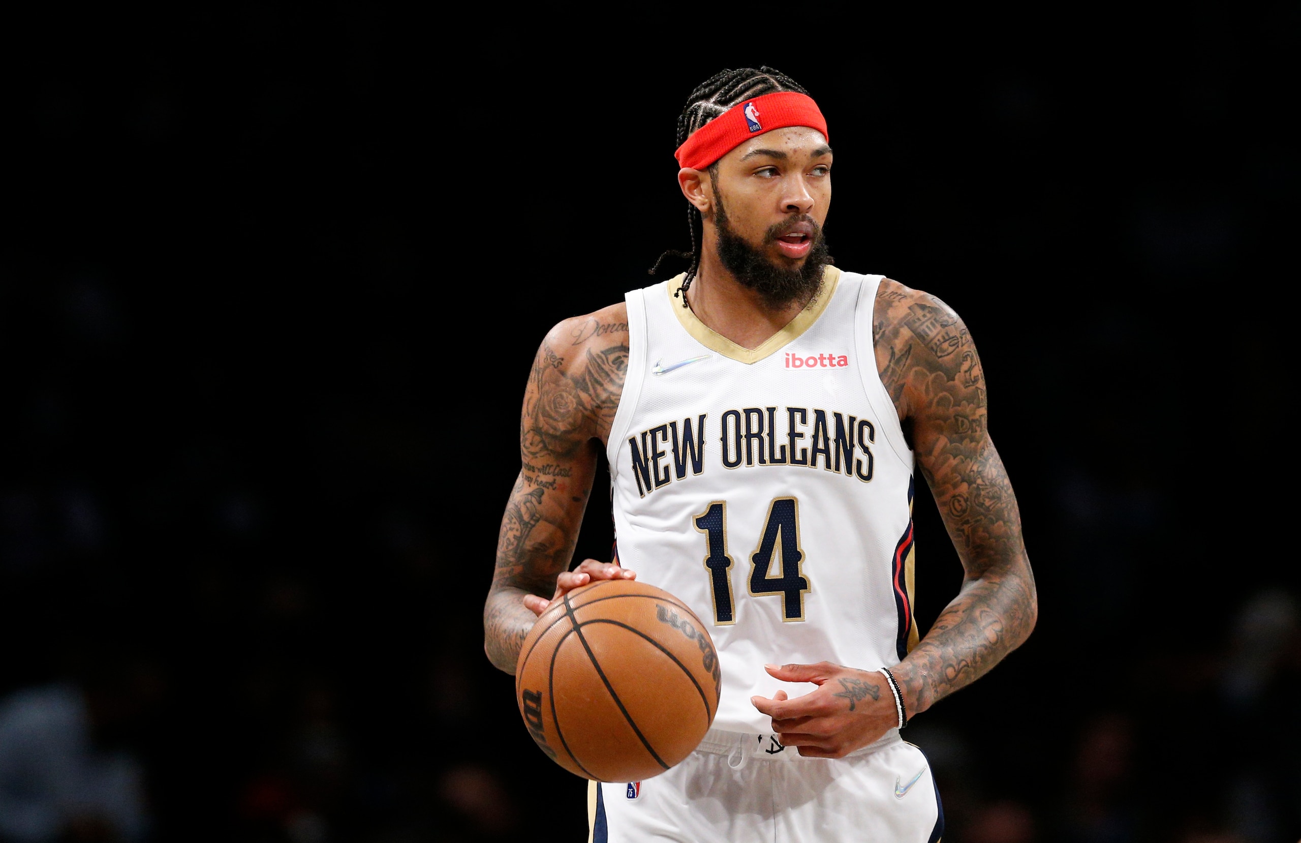 New Orleans Pelicans forward Brandon Ingram (14) dribbles the ball against the Brooklyn Nets during the second half of an NBA basketball game, Saturday, Jan. 15, 2022 in New York. The Brooklyn Nets won 120-105. (AP Photo/Noah K. Murray)