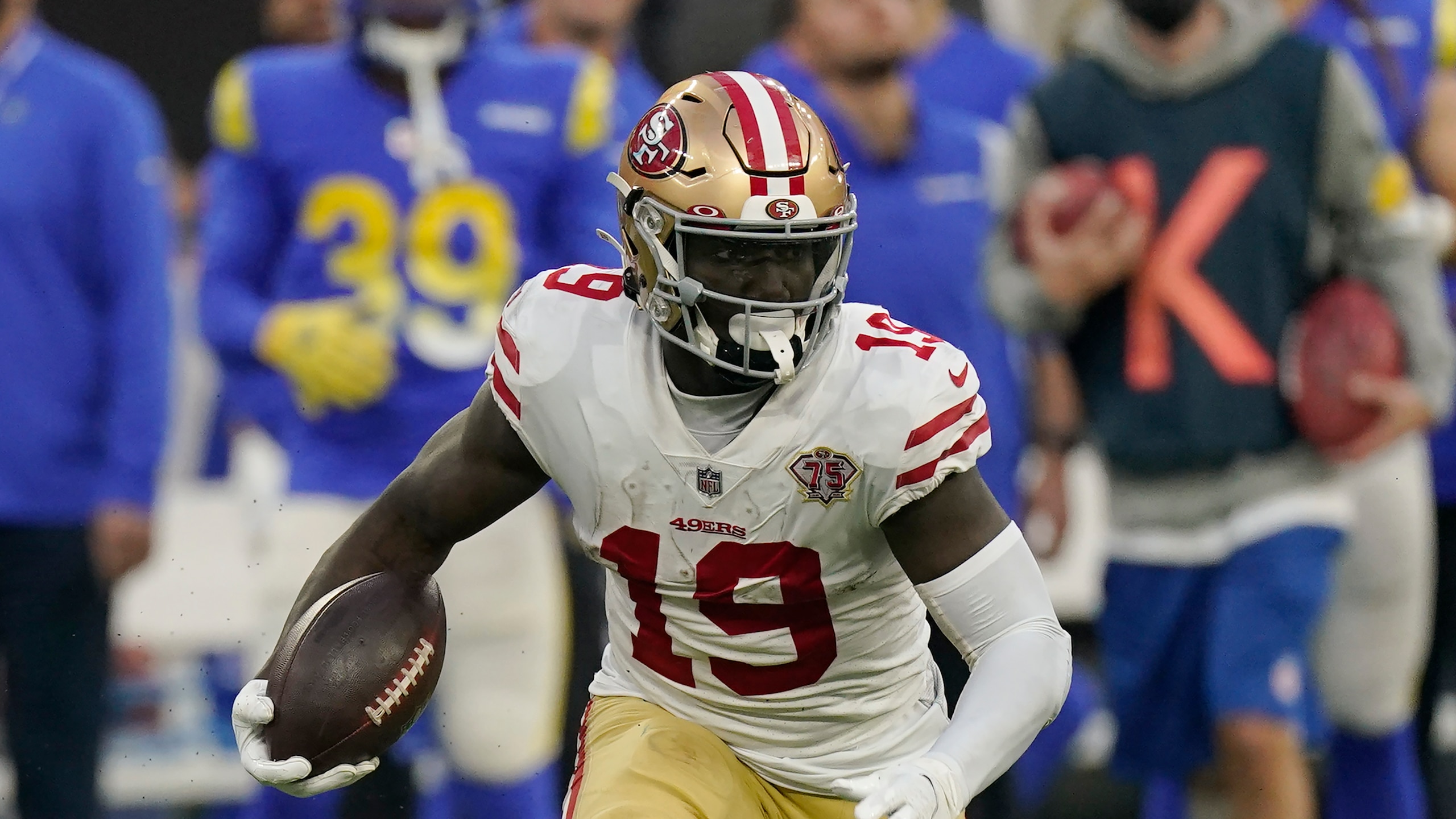 San Francisco 49ers wide receiver Deebo Samuel (19) runs the ball during an NFL football game against the Los Angeles Rams Sunday, Jan. 9, 2022, in Inglewood, Calif. (AP Photo/Mark J. Terrill)