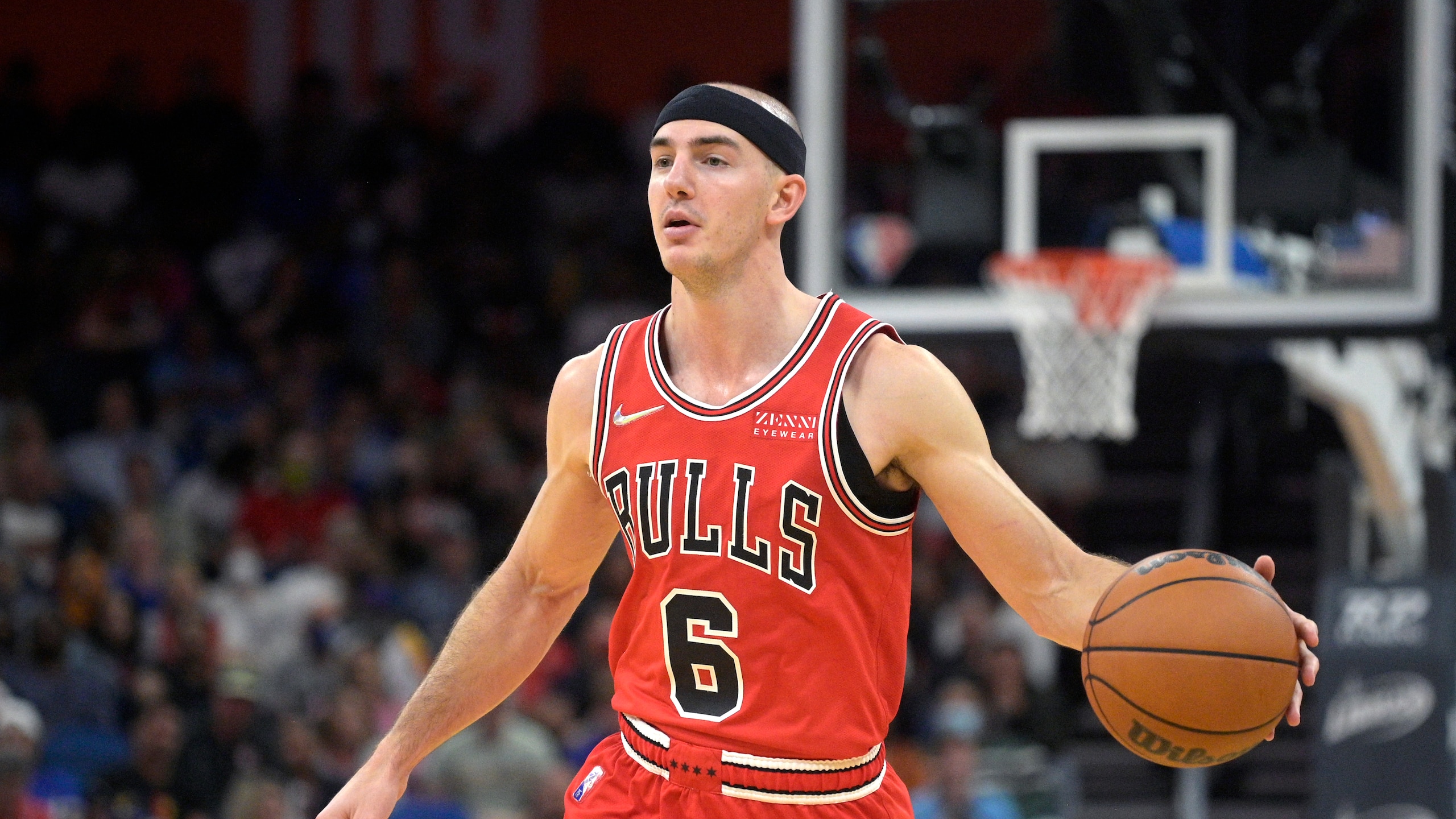 Chicago Bulls guard Alex Caruso (6) sets up a play during the second half of an NBA basketball game against the Orlando Magic, Friday, Nov. 26, 2021, in Orlando, Fla. (AP Photo/Phelan M. Ebenhack)