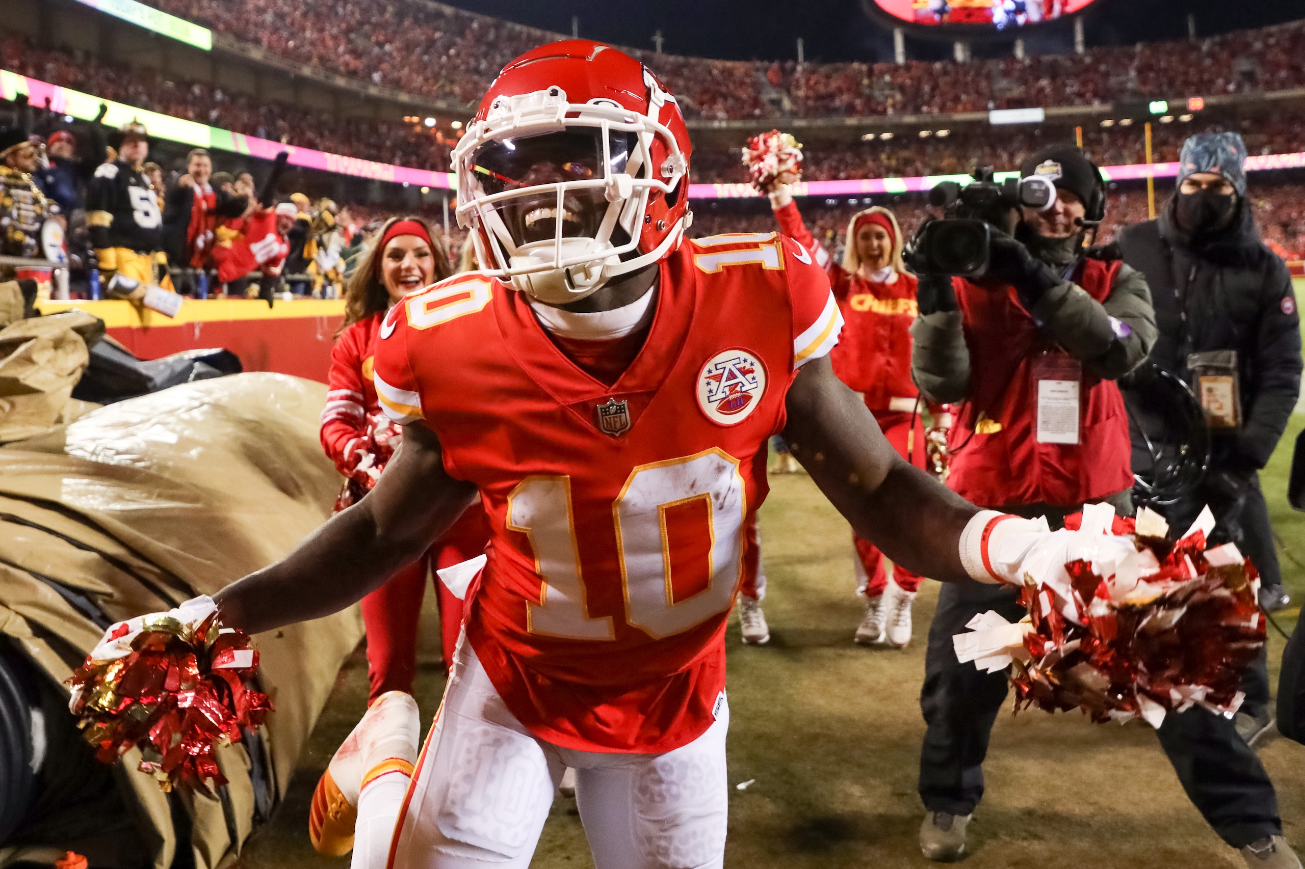 KANSAS CITY, MISSOURI - JANUARY 16: Tyreek Hill #10 of the Kansas City Chiefs celebrates after scoring a touchdown against the Pittsburgh Steelers in the third quarter of the game in the NFC Wild Card Playoff game at Arrowhead Stadium on January 16, 2022 in Kansas City, Missouri. (Photo by Dilip Vishwanat/Getty Images)