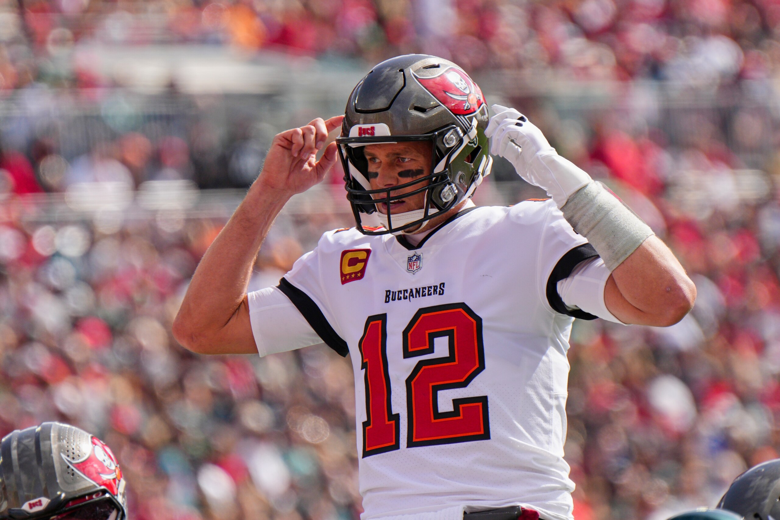TAMPA, FL - JANUARY 16: Tampa Bay Buccaneers quarterback Tom Brady (12) calls an audible during the game between the Philadelphia Eagles and the Tampa Bay Buccaneers on January 16, 2022 at  Raymond James Stadium in Tampa, FL. (Photo by Andy Lewis/Icon Sportswire via Getty Images)