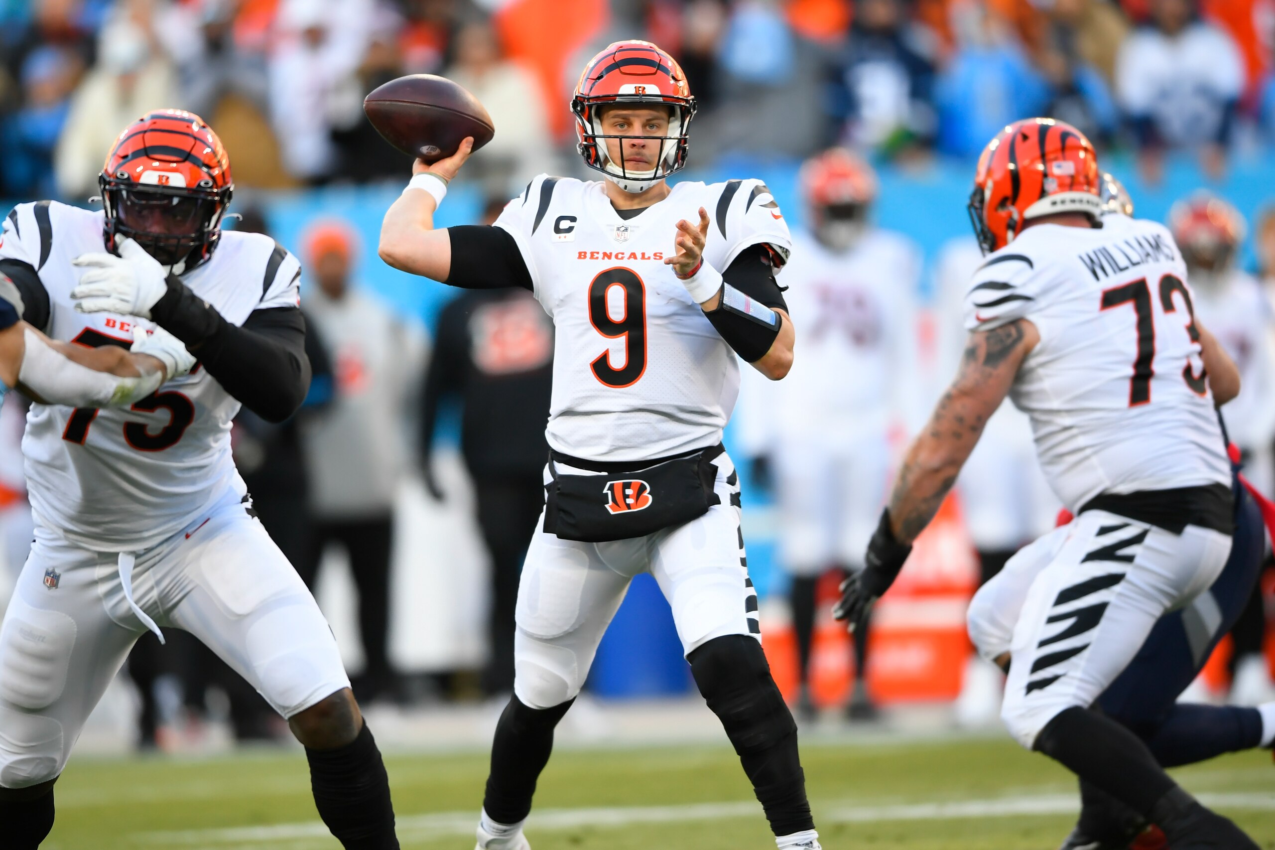 Cincinnati Bengals quarterback Joe Burrow (9) pases from the pocket against the Tennessee Titans during the first half of an NFL divisional round playoff football game, Saturday, Jan. 22, 2022, in Nashville, Tenn. (AP Photo/John Amis)
