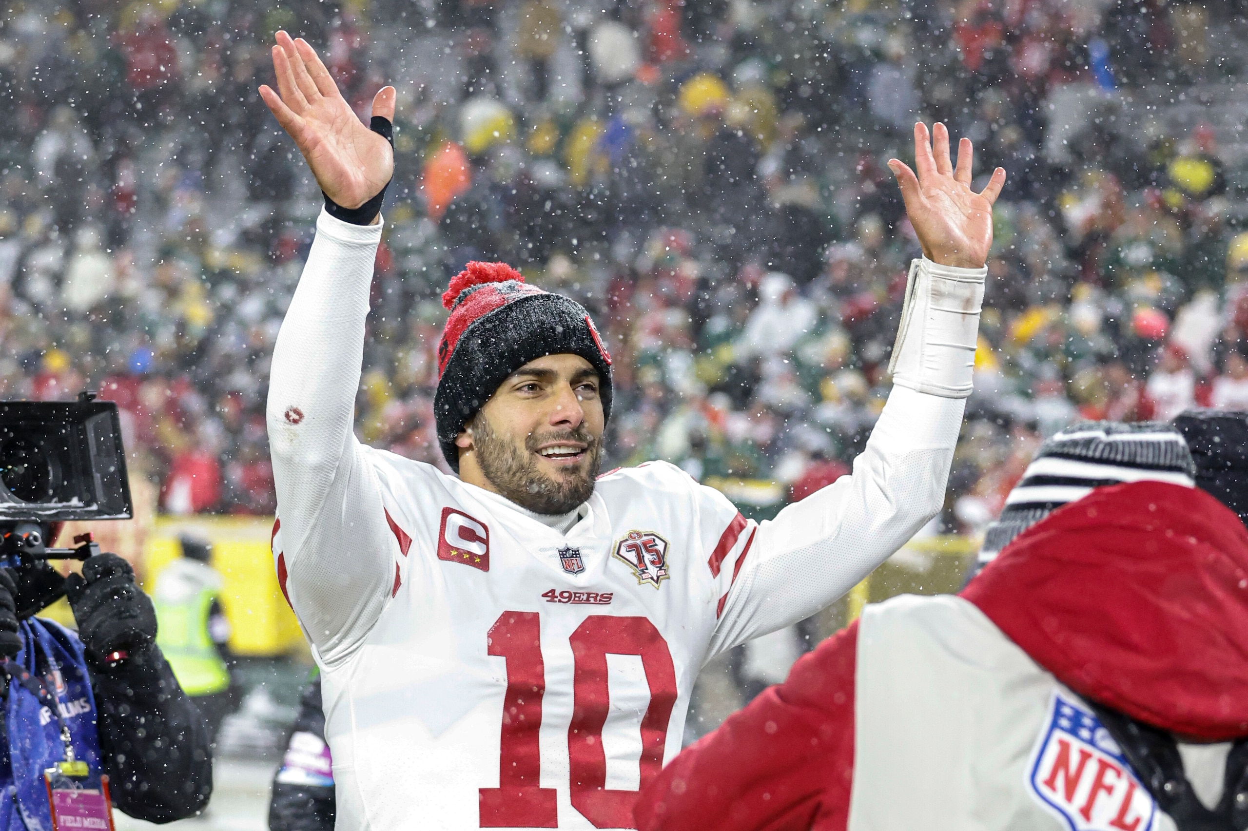 San Francisco 49ers quarterback Jimmy Garoppolo (10) reacts after beating the Green Bay Packers in an NFL divisional playoff football game, Saturday, Jan 22. 2022, in Green Bay, Wis. (AP Photo/Jeffrey Phelps)