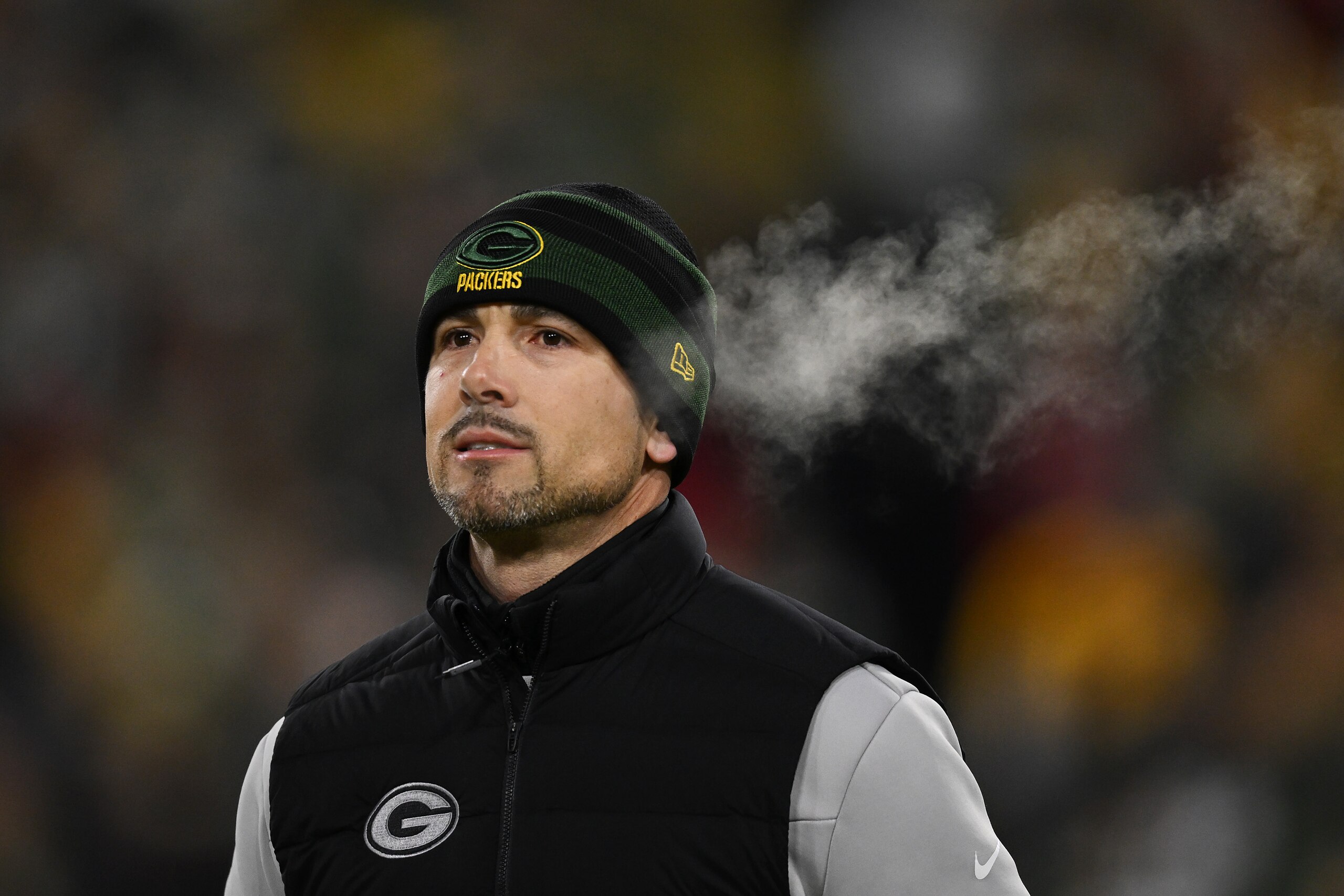 GREEN BAY, WISCONSIN - JANUARY 22:  Head coach Matt LaFleur of the Green Bay Packers watches during pre-game warm-ups prior to the NFC Divisional Playoff game against the San Francisco 49ers at Lambeau Field on January 22, 2022 in Green Bay, Wisconsin. (Photo by Quinn Harris/Getty Images)