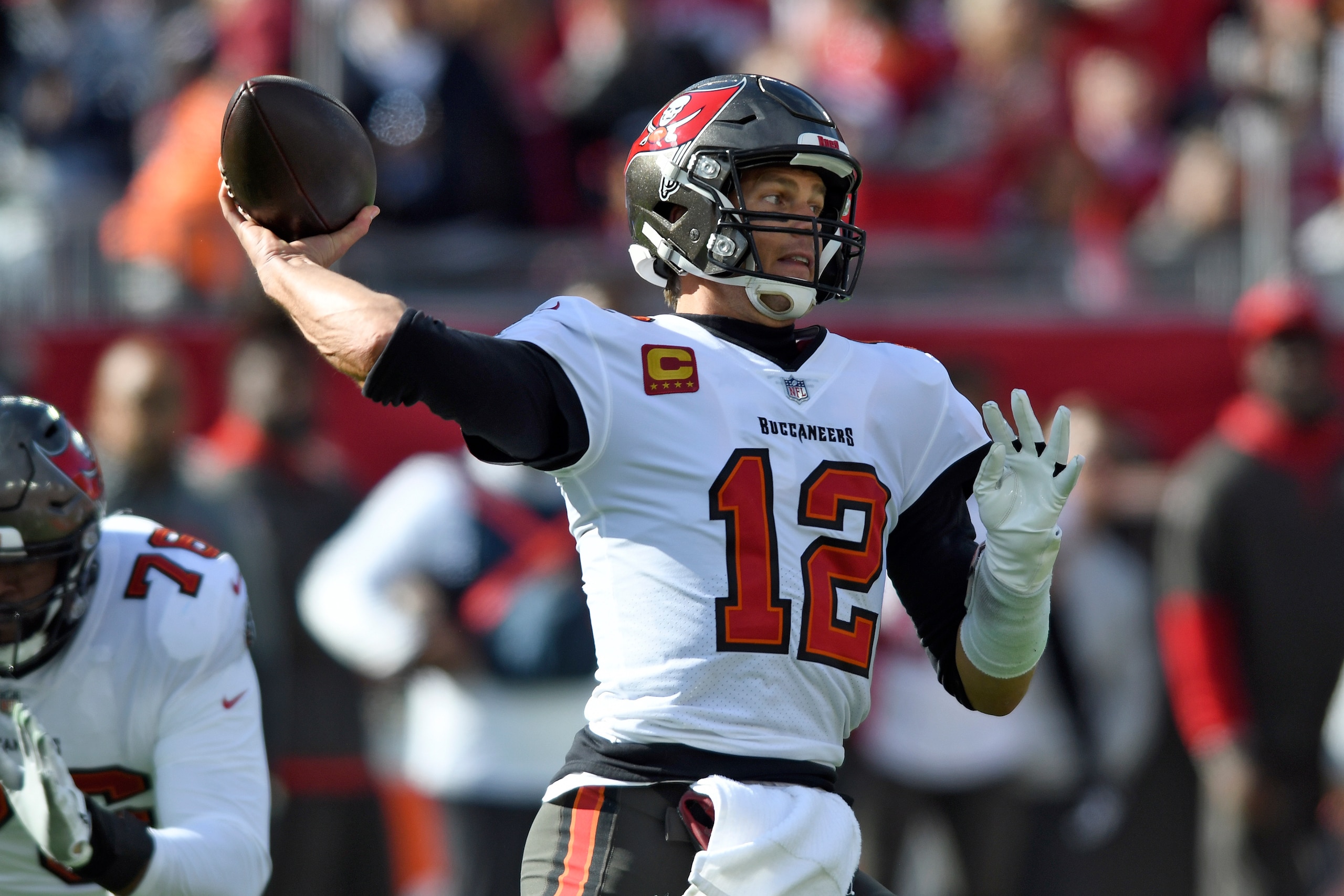 Tampa Bay Buccaneers quarterback Tom Brady (12) throws a pass during the first half of an NFL divisional round playoff football game against the Los Angeles Rams Sunday, Jan. 23, 2022, in Tampa, Fla. (AP Photo/Jason Behnken)