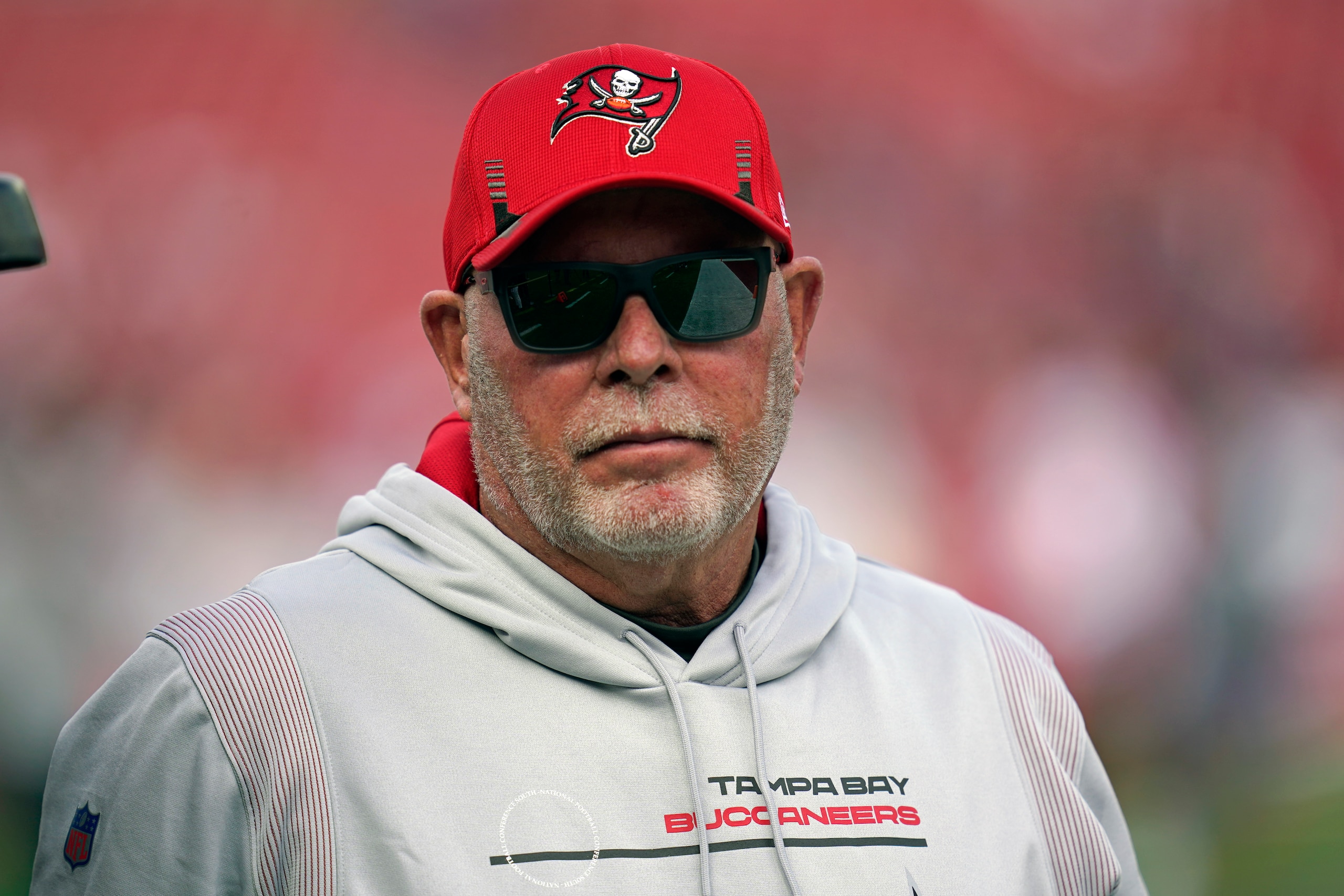 Tampa Bay Buccaneers head coach Bruce Arians arrives on the field before an NFL divisional round playoff football game against the Los Angeles Rams, Sunday, Jan. 23, 2022, in Tampa, Fla. (AP Photo/John Raoux)