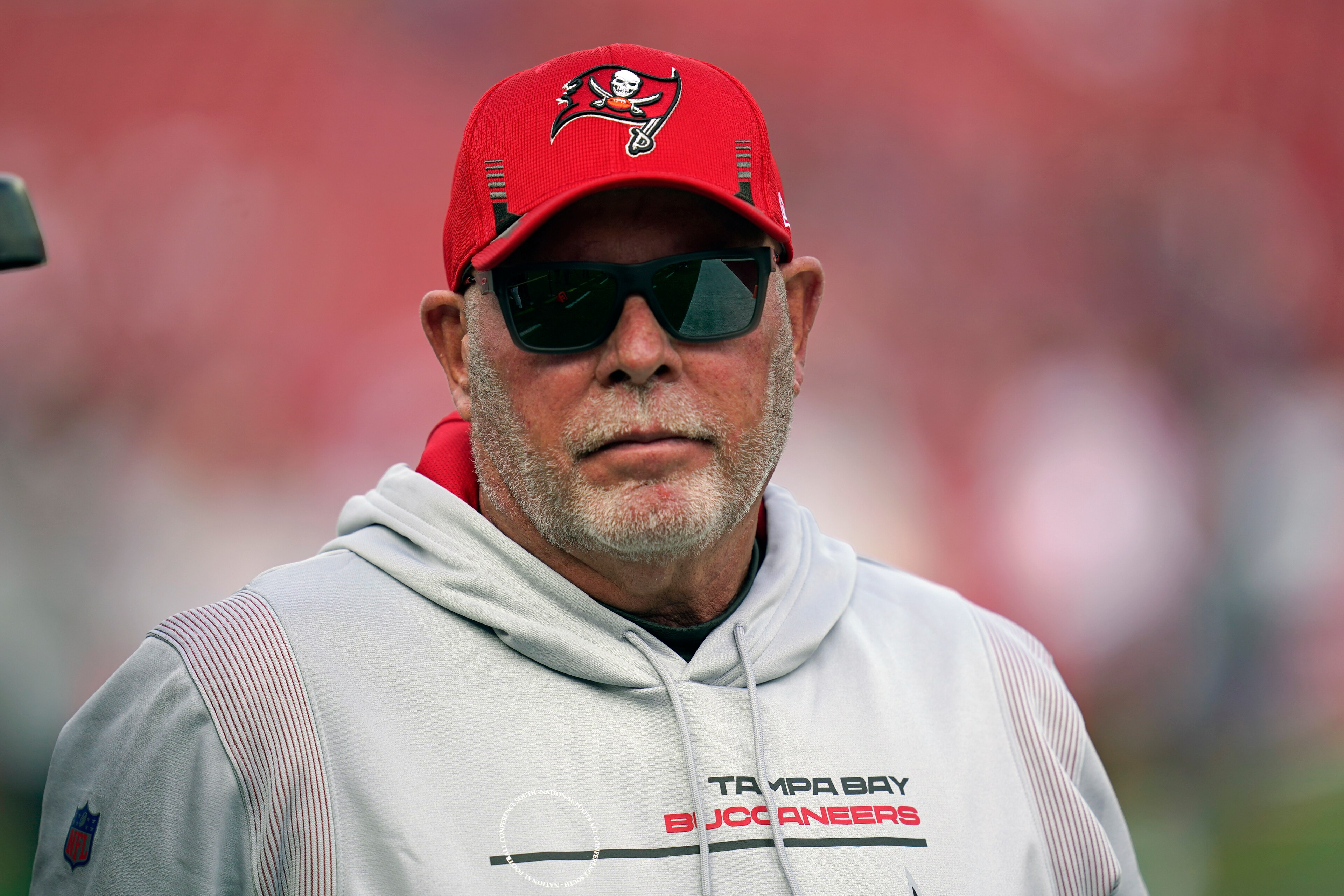 Tampa Bay Buccaneers head coach Bruce Arians arrives on the field before an NFL divisional round playoff football game against the Los Angeles Rams, Sunday, Jan. 23, 2022, in Tampa, Fla. (AP Photo/John Raoux)