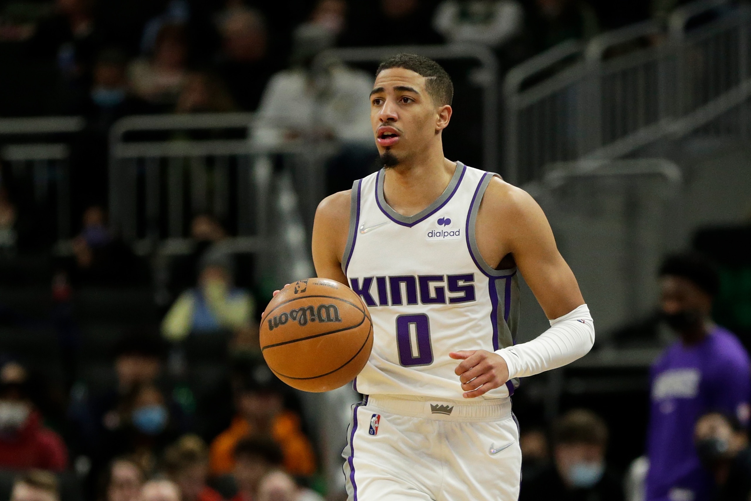 MILWAUKEE, WISCONSIN - JANUARY 22: Tyrese Haliburton #0 of the Sacramento Kings dribbles the basketball up court during the second half of the game against the Milwaukee Bucks at Fiserv Forum on January 22, 2022 in Milwaukee, Wisconsin. Bucks defeated the Kings 133-127. NOTE TO USER: User expressly acknowledges and agrees that, by downloading and or using this photograph, User is consenting to the terms and conditions of the Getty Images License Agreement. (Photo by John Fisher/Getty Images)