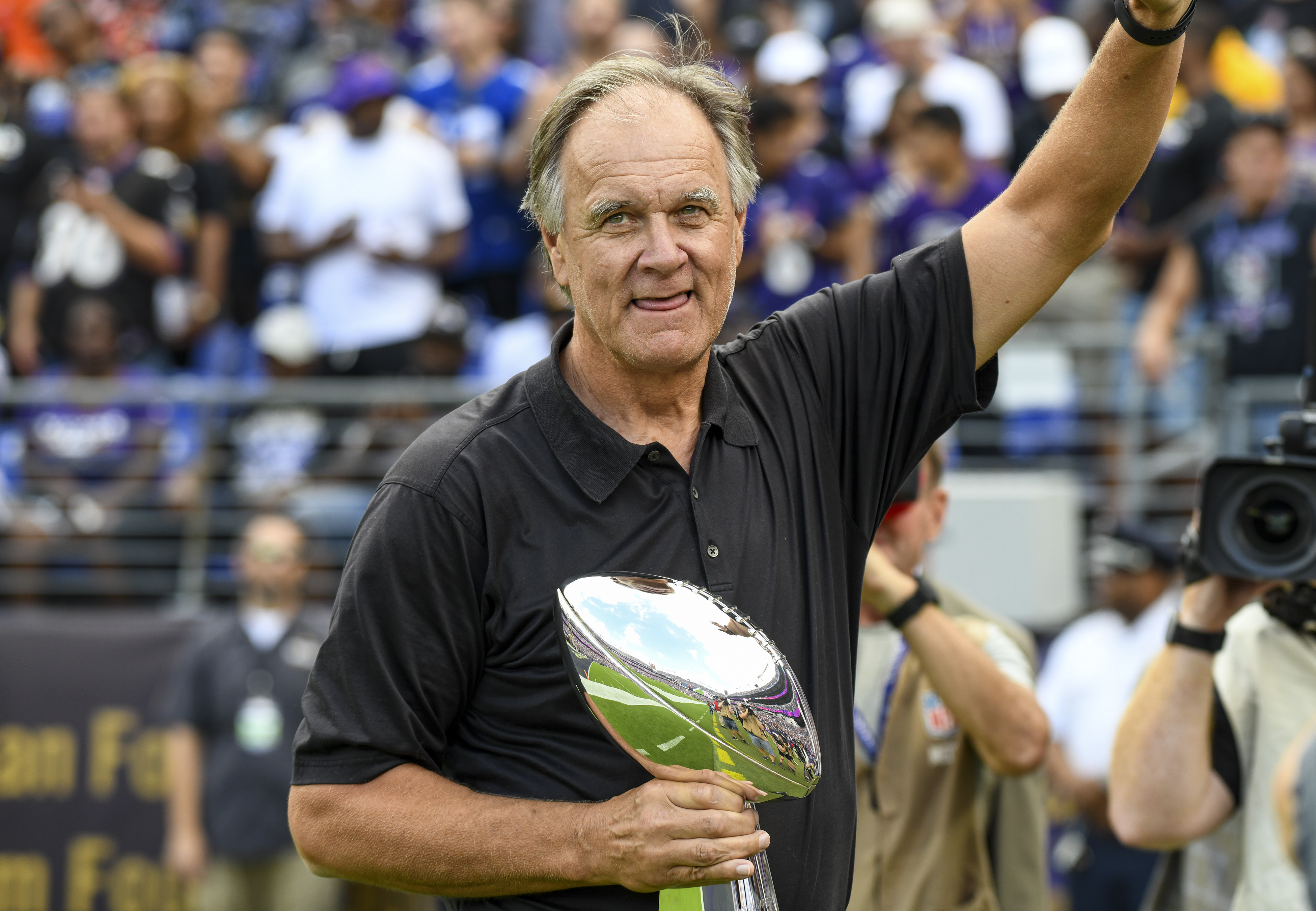 BALTIMORE, MD - SEPTEMBER 29: Former Baltimore Ravens head coach Brian Billick is introduced to the crowd and shows the Super Bowl trophy won in 2000 prior to the game against the Cleveland Browns on September 29, 2019, at M&T Bank Stadium in Baltimore, MD. (Photo by Mark Goldman/Icon Sportswire via Getty Images)